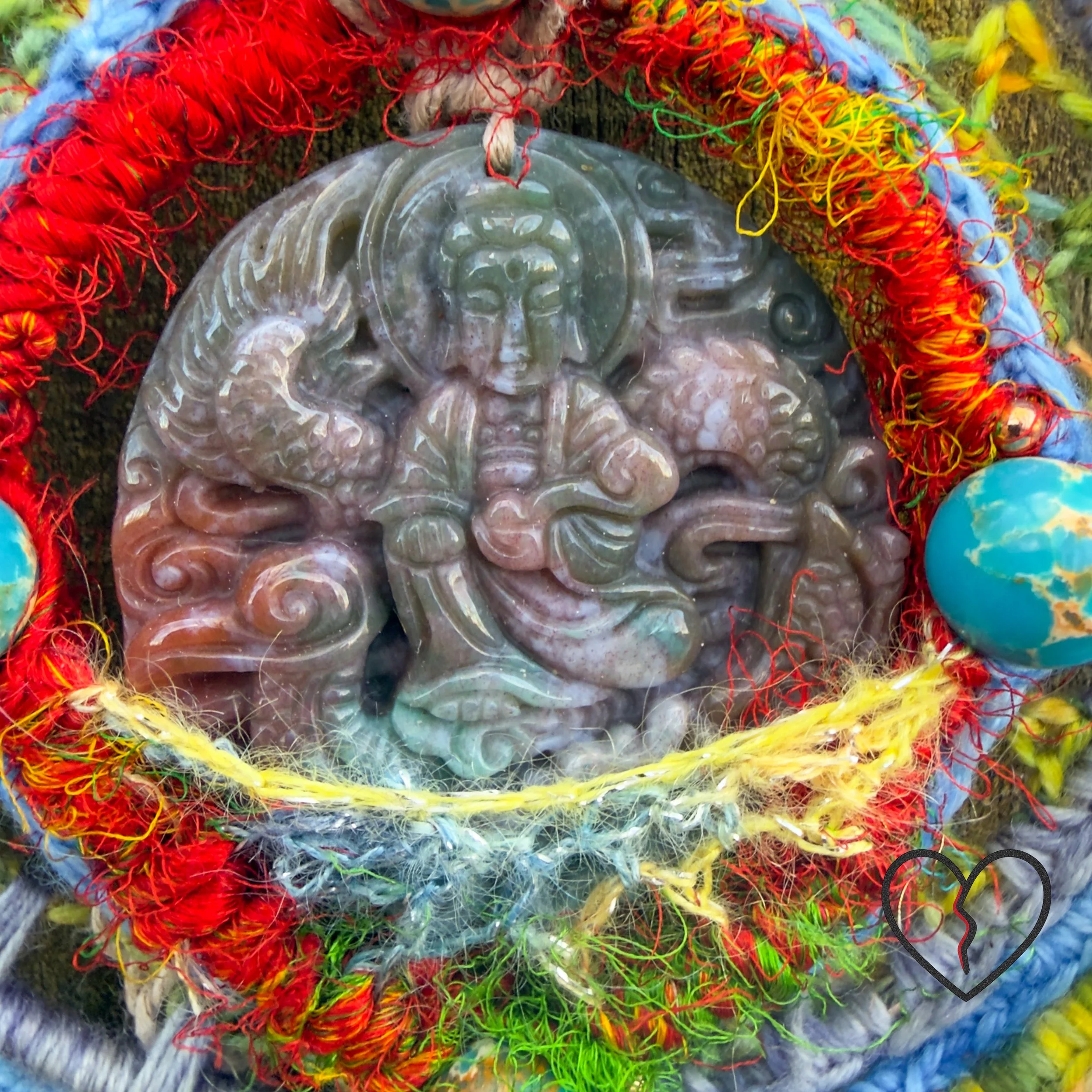 Handmade freeform crochet Dreamcatcher featuring a carved jade Buddha, painted howlite beads, silk, wool, and hemp. One-of-a-kind fiber art wall hanging.
