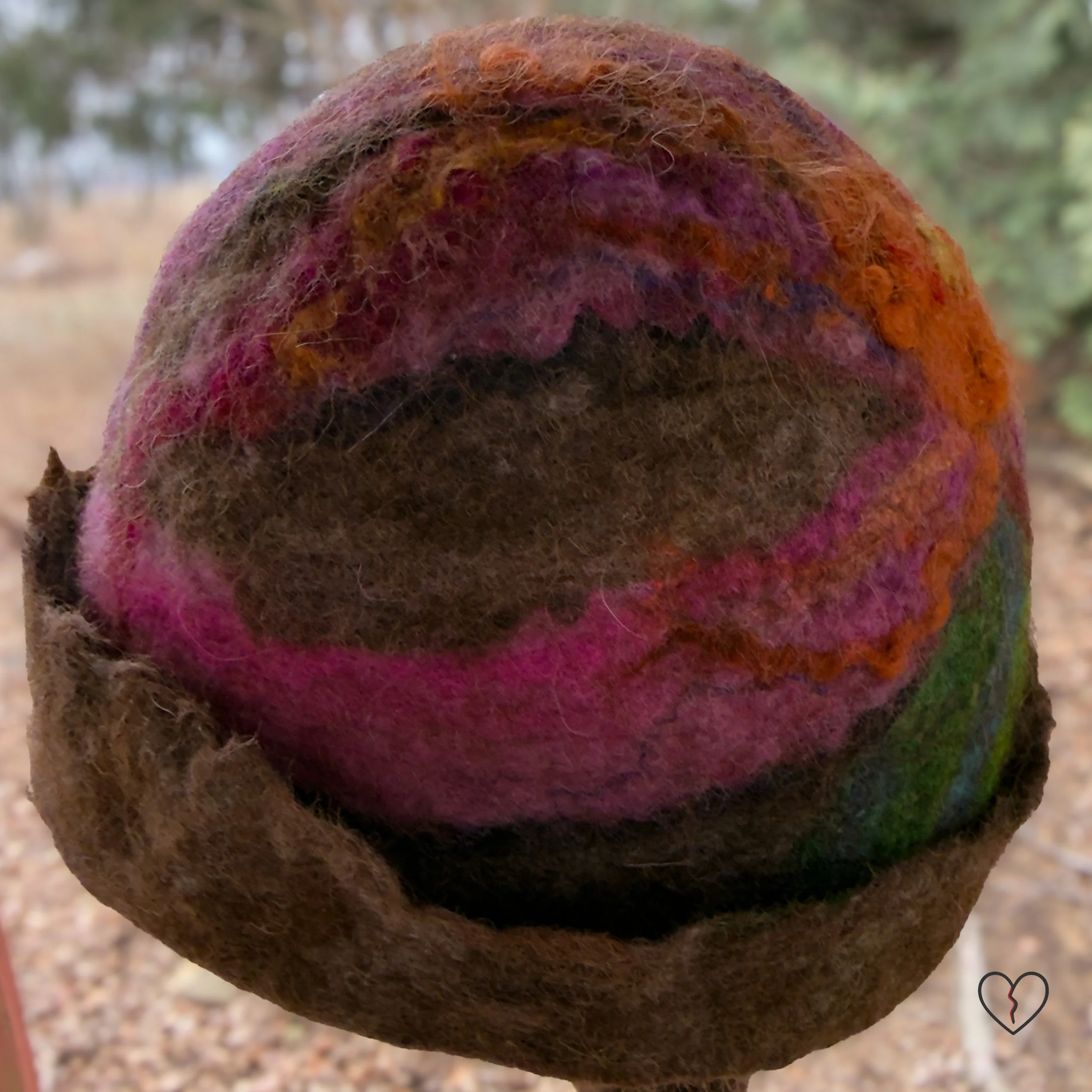 Close-up of textured brown felted wool with blended fibers