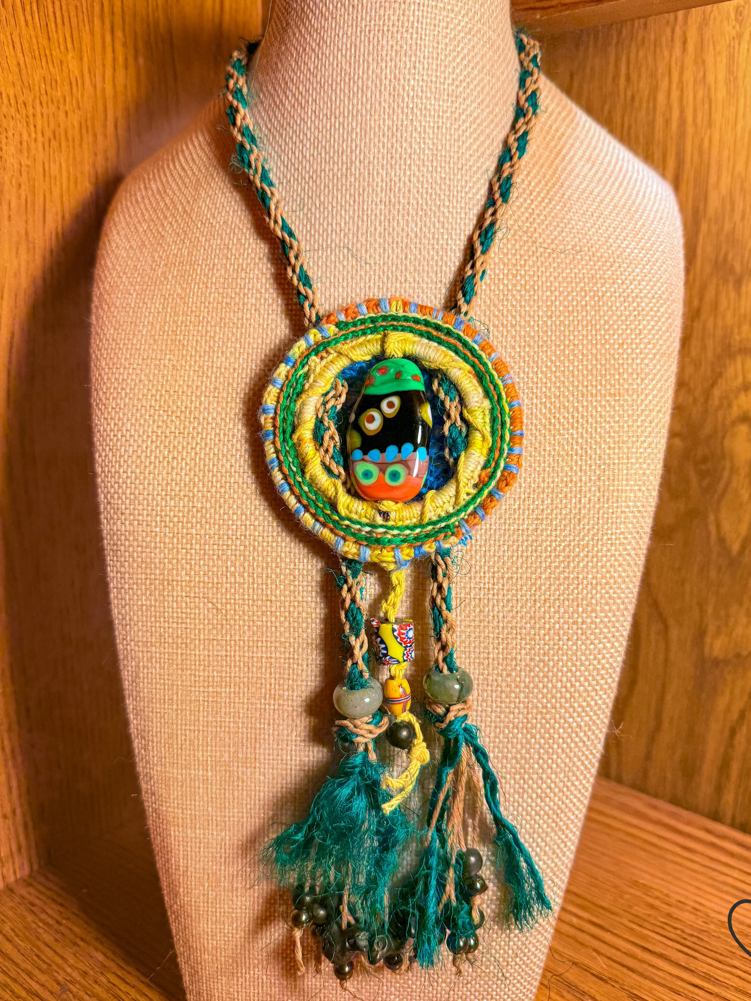 Fiber necklace with wool pendant and glass focal bead