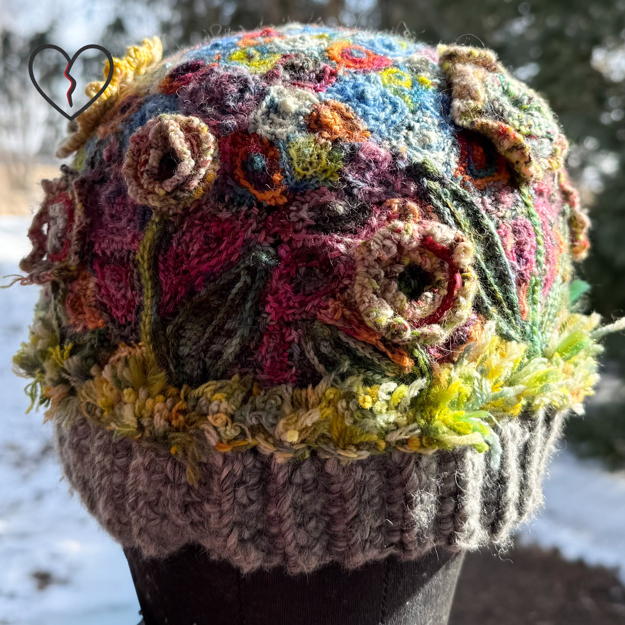 Top crown detail revealing dense freeform crochet texture and organic color transitions