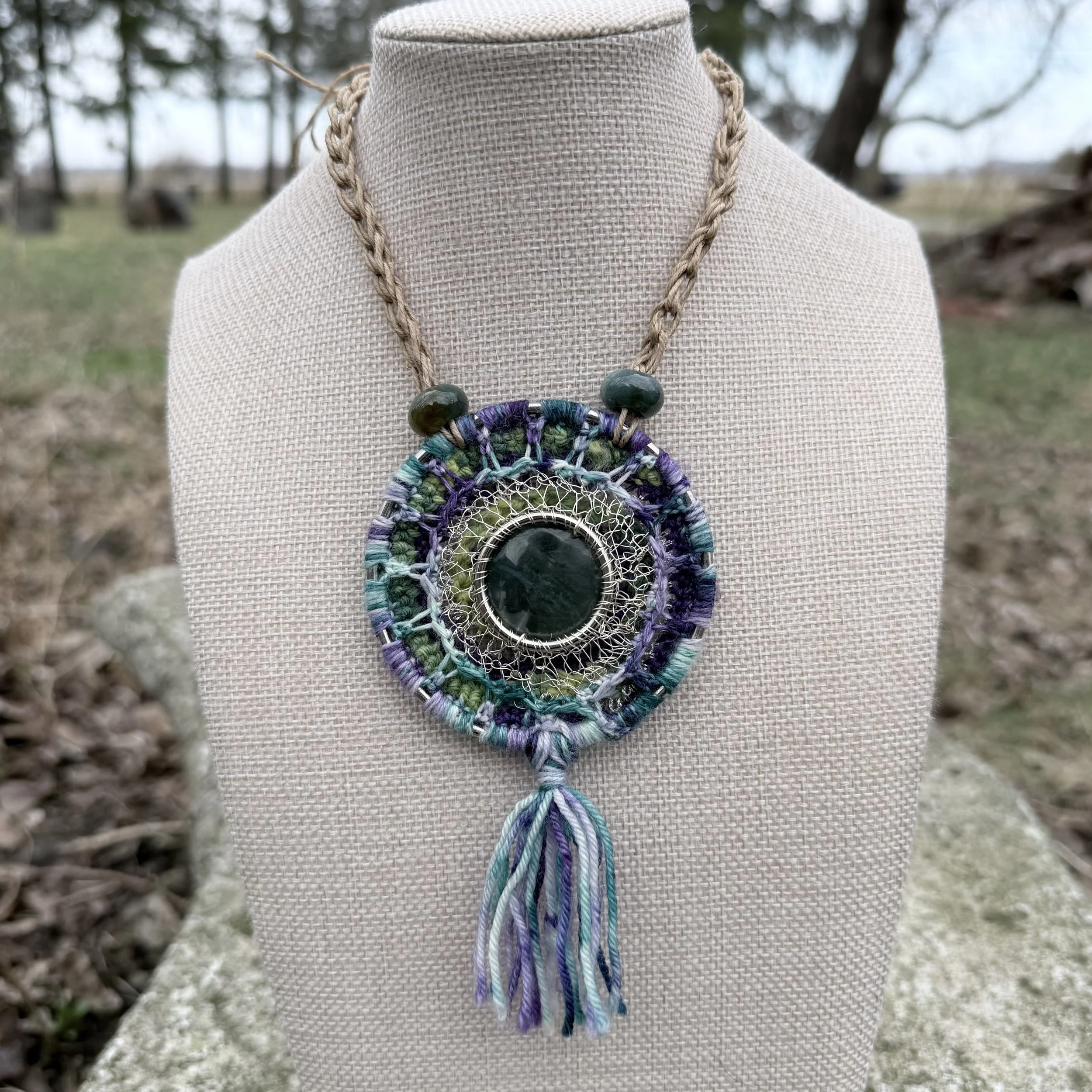 Spring Forest Amulet with moss agate center, crocheted wool and wire setting, serpentine beads