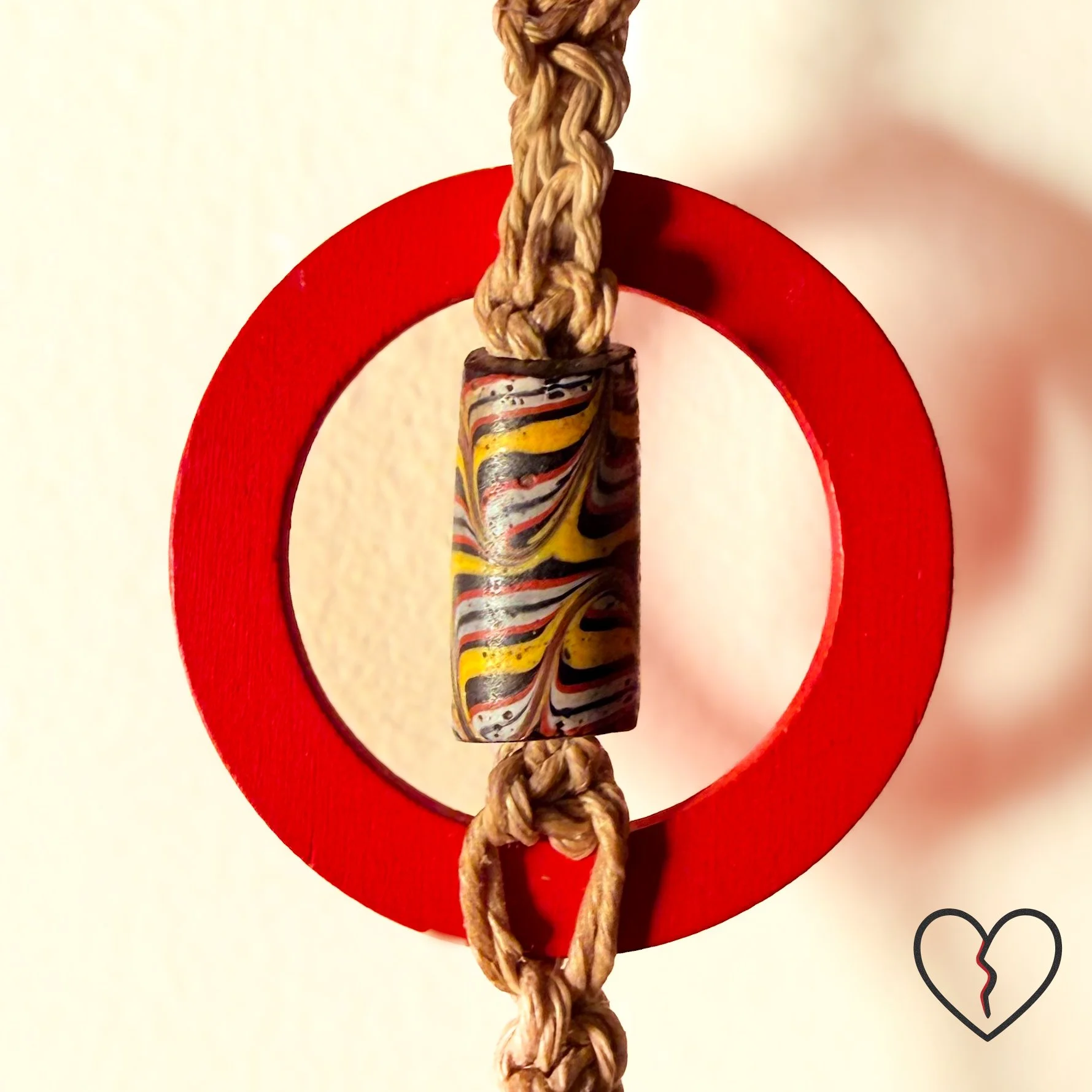 Hand crocheted wool and sari silk dreamcatcher with reclaimed prism and African trade beads representing protection, journey, and illumination. One of a kind fiber wall hanging by Kristi Yapp, 2024.