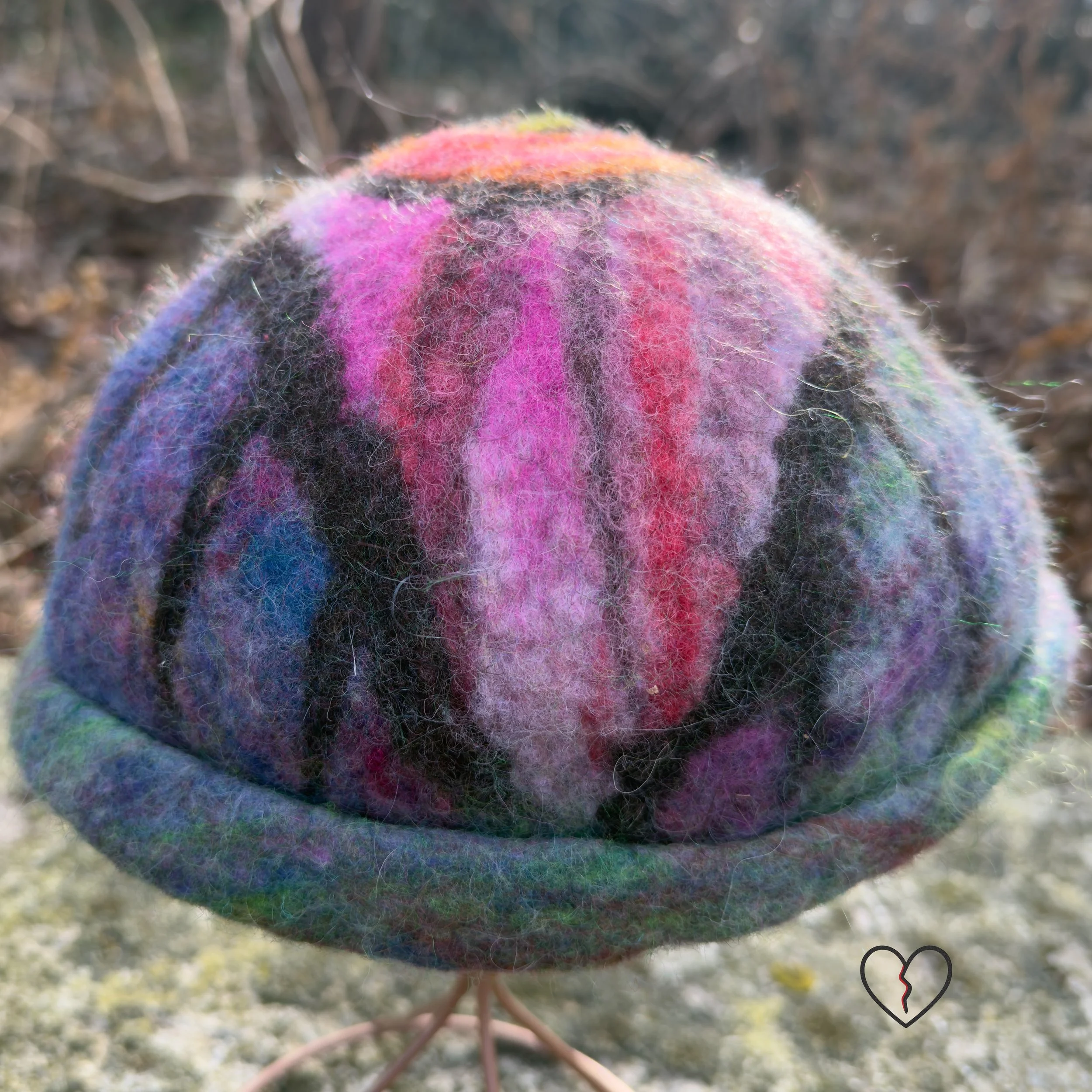 Hand-felted wool hat with a symbolic eye and celestial purple-blue design.