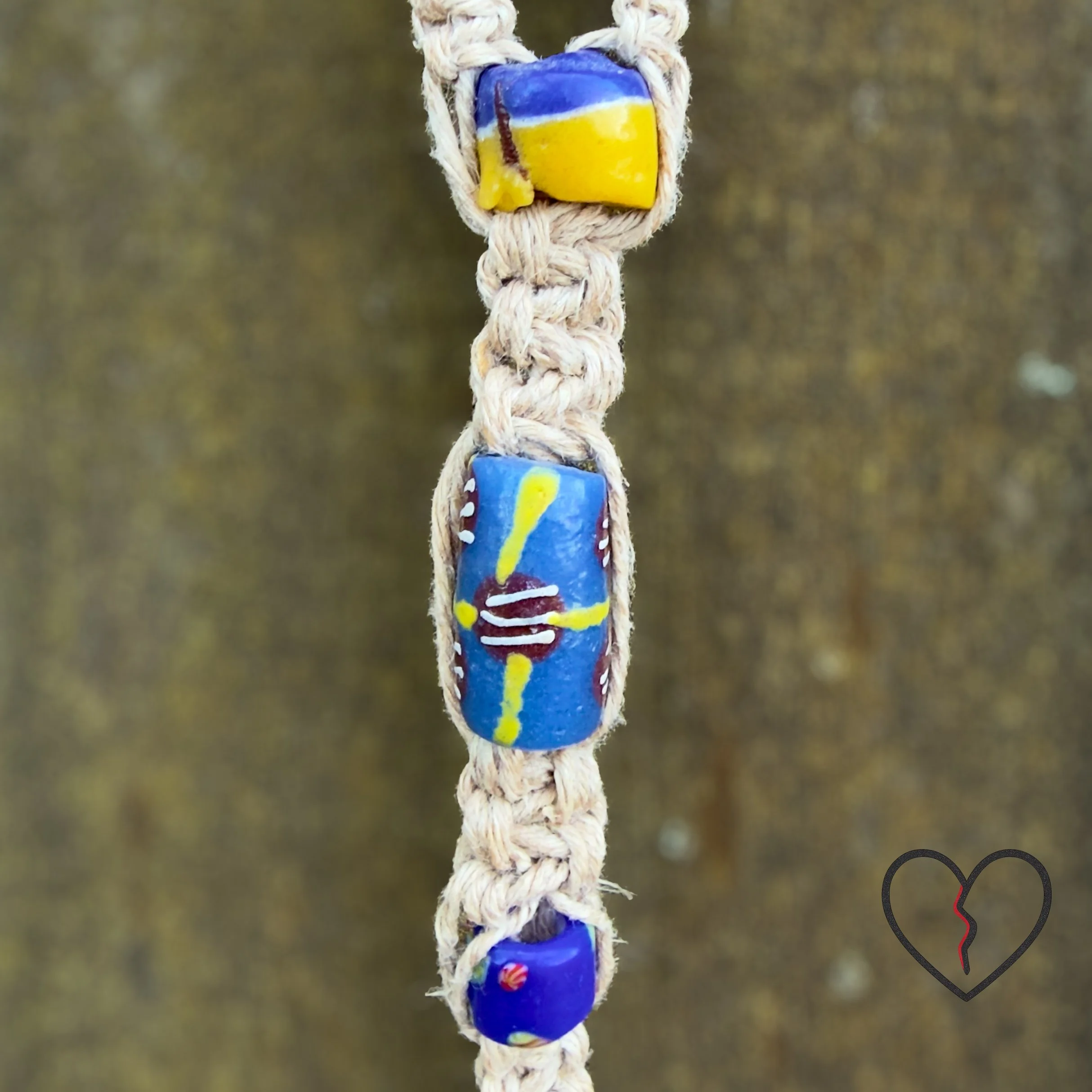 Handmade freeform crochet Dreamcatcher featuring a carved jade Buddha, painted howlite beads, silk, wool, and hemp. One-of-a-kind fiber art wall hanging.