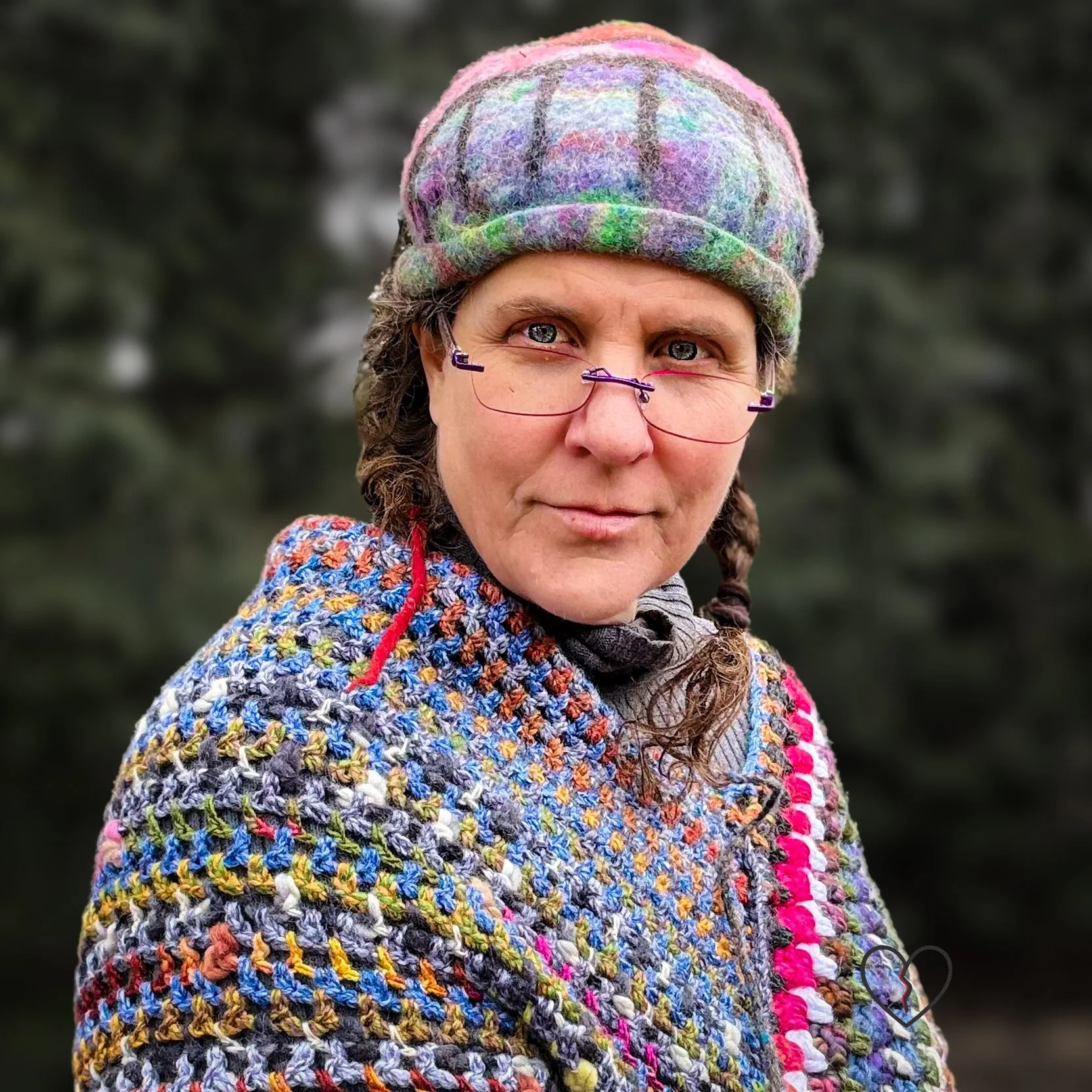 Hand-felted wool hat with a symbolic eye and celestial purple-blue design.