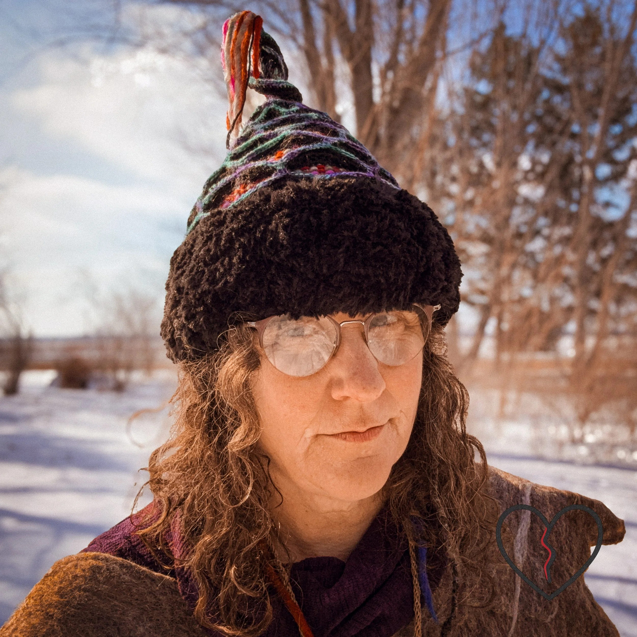 Handwoven and freeform crochet sculptural headpiece with lattice structure, woven wool interior, faux fur brim, and spike, inspired by Mongolian war helmets.