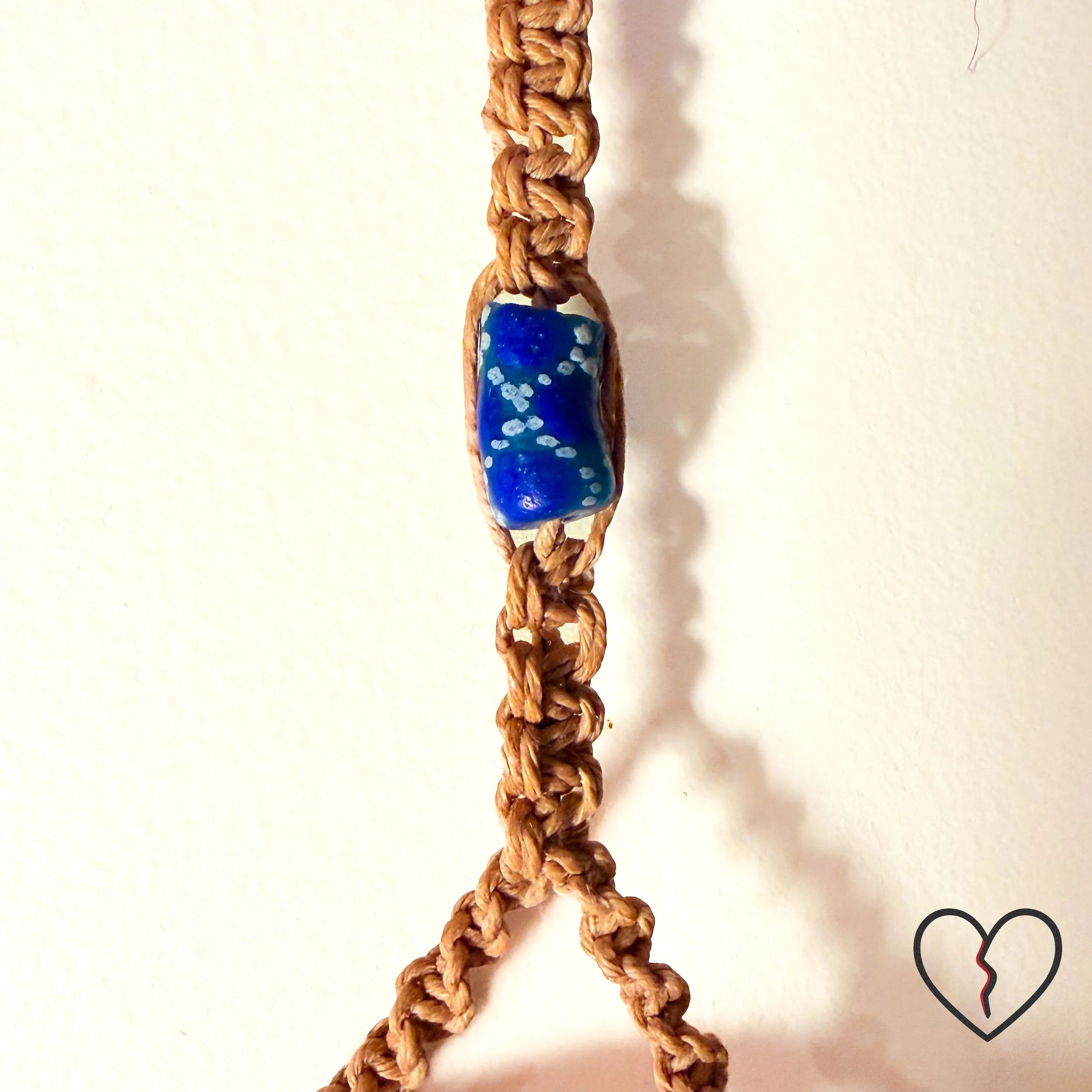 Close view of carved bone sea turtle symbolizing endurance, ancestral protection, and continuity.