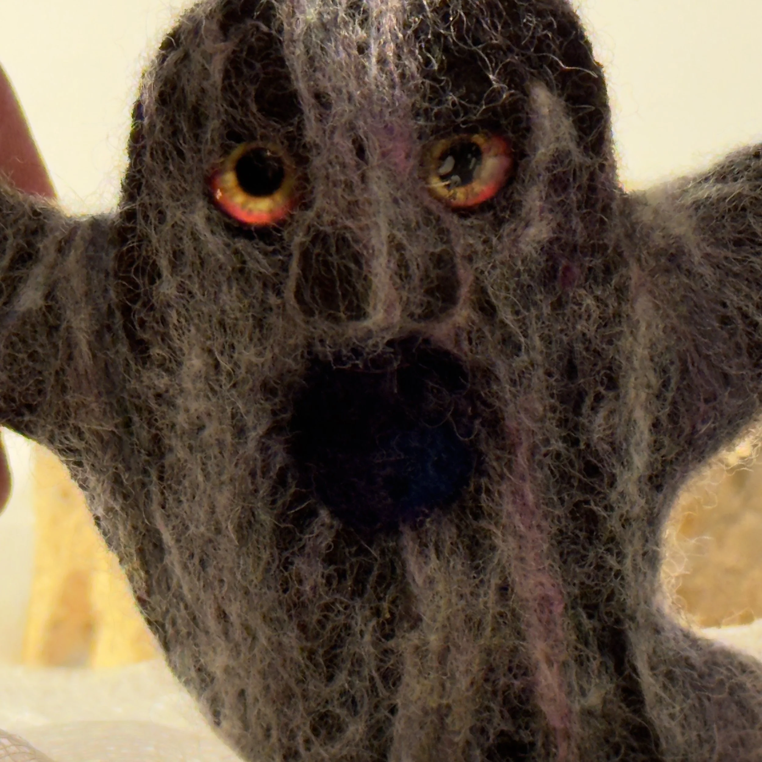 Handmade needle felted wool art pins arranged as a small collection, each approximately two inches square, featuring sculptural forms, layered fiber texture, and earthy tones.