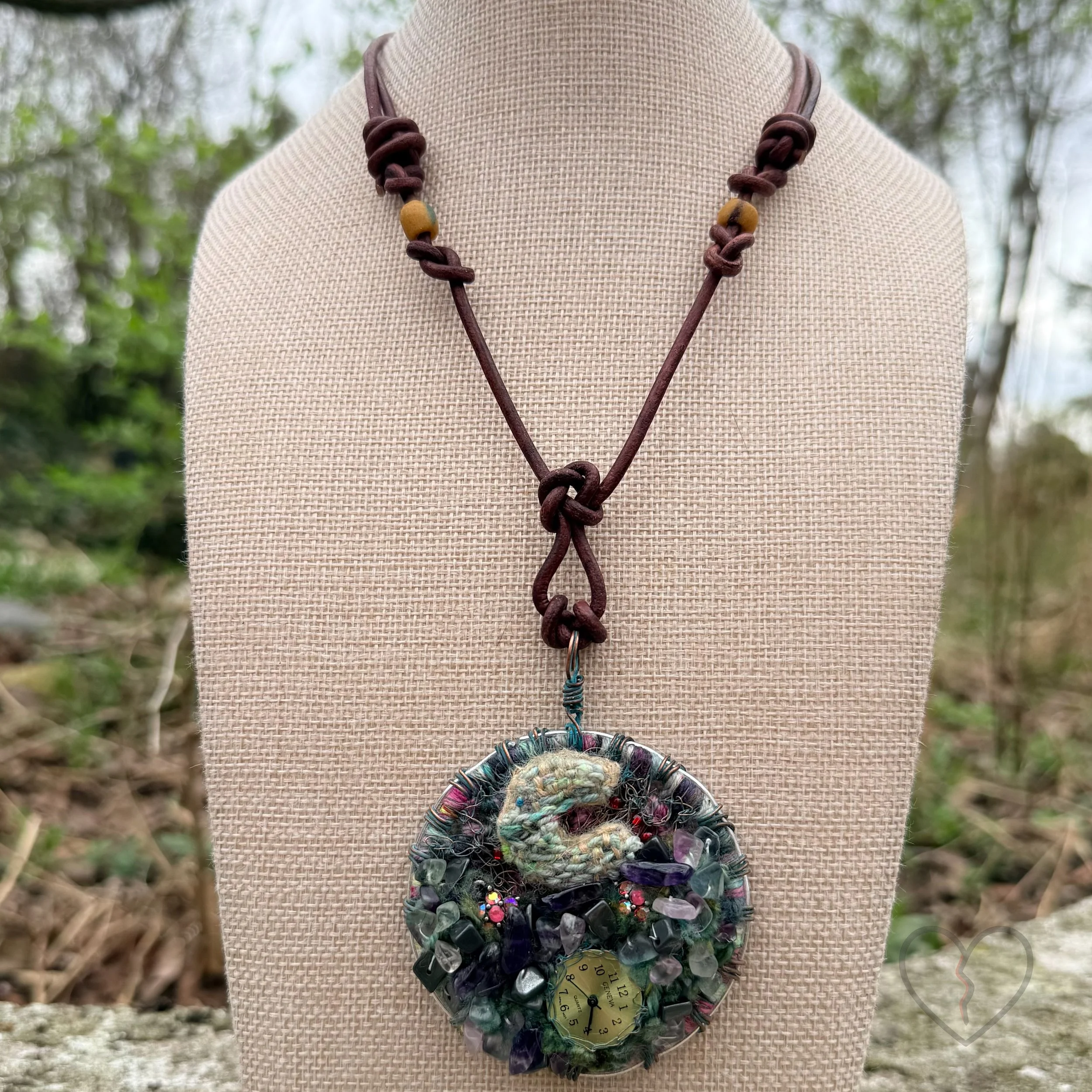 Mixed media fiber necklace with crystals and broken clock face on leather cord