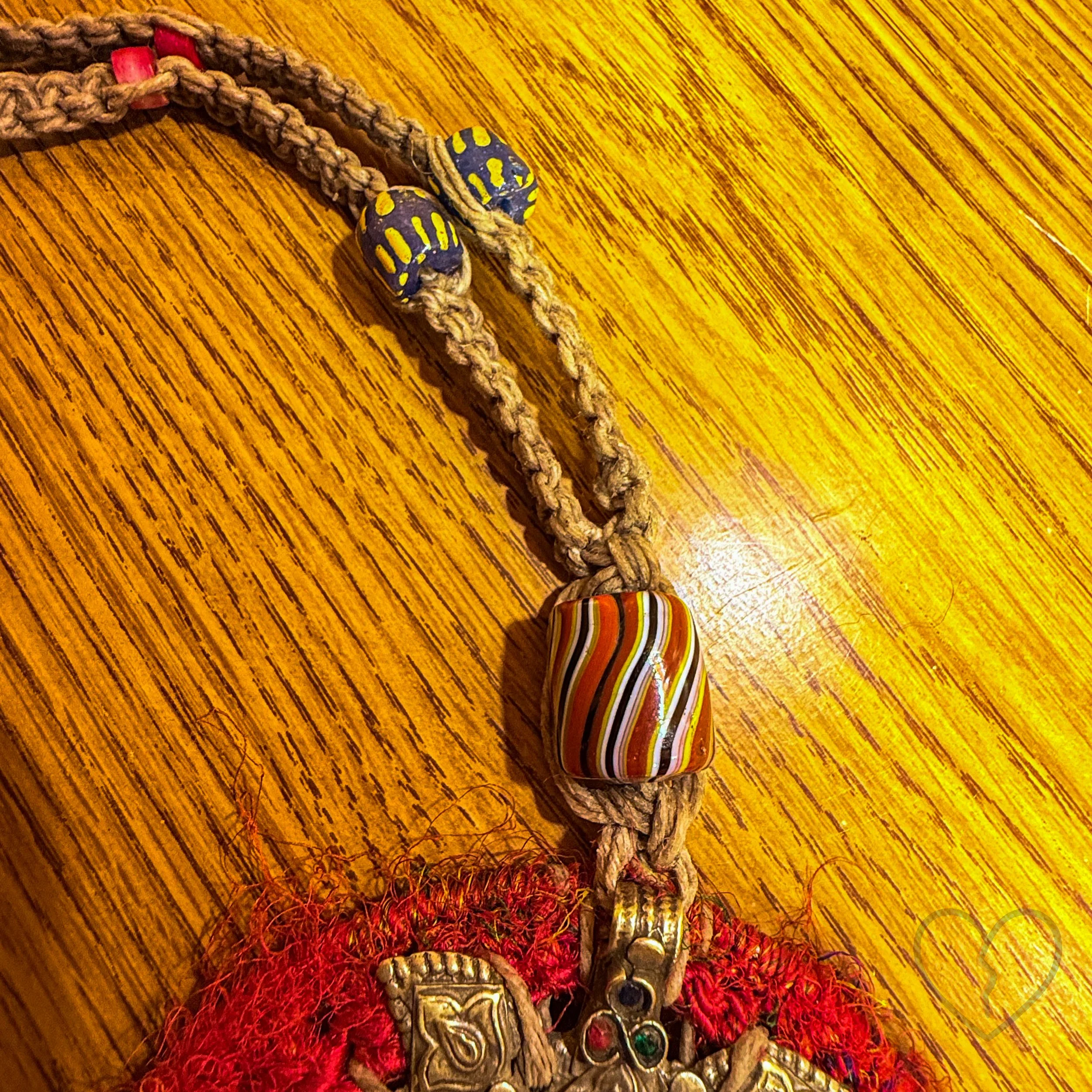 Fiber art necklace with reclaimed pendant, sari silk halo and macrame hemp cord by Kristi Yapp