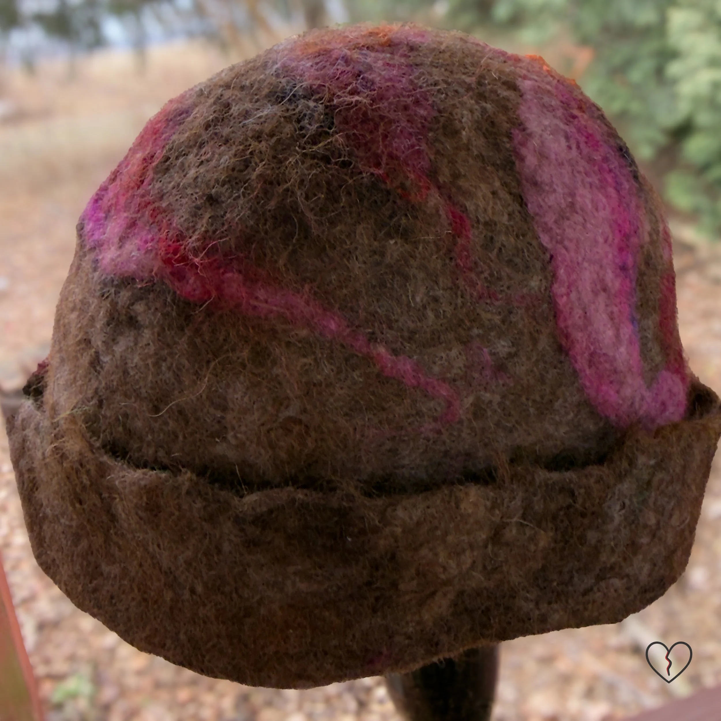 Back view of structured wool hat with natural edge brim