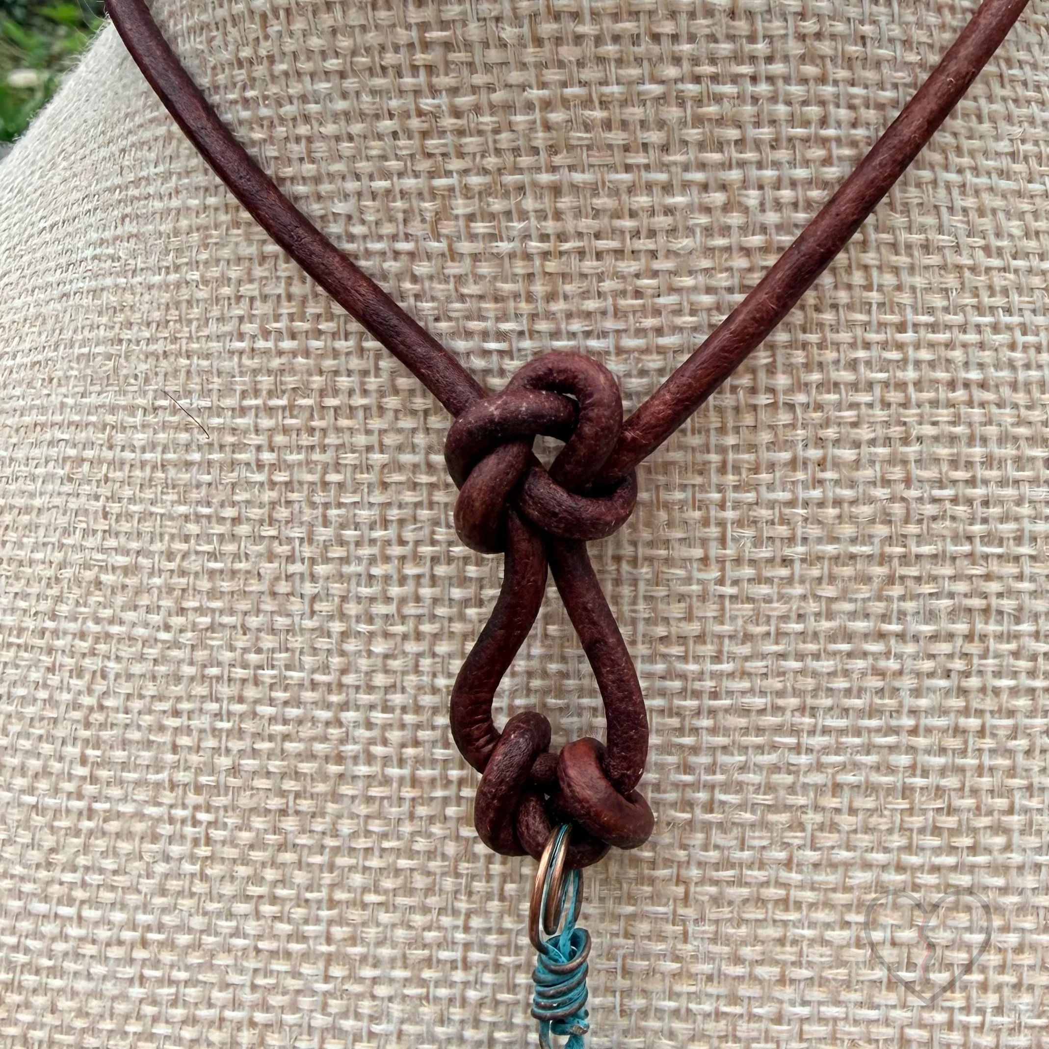 Mixed media fiber necklace with crystals and broken clock face on leather cord