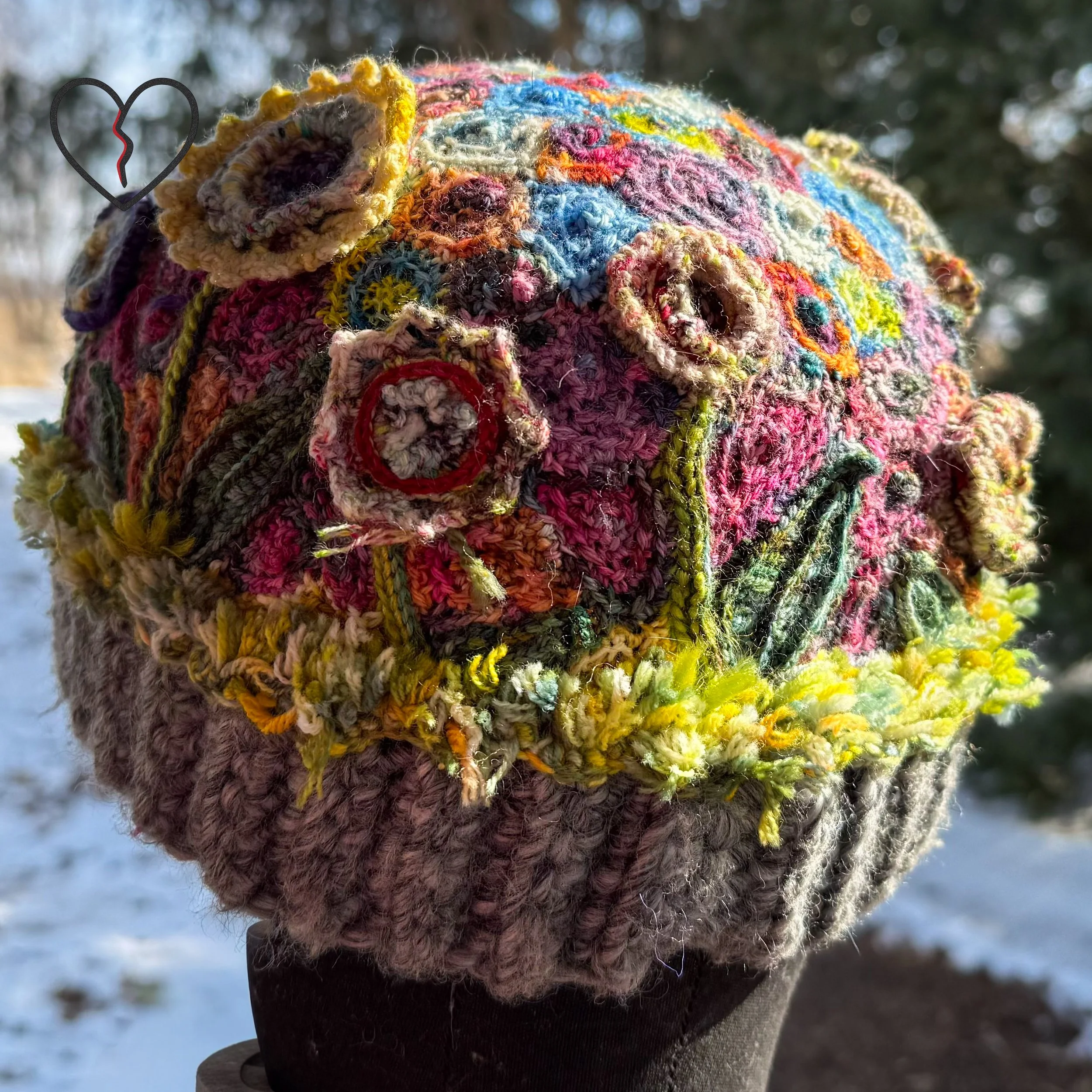 Top crown detail revealing dense freeform crochet texture and organic color transitions