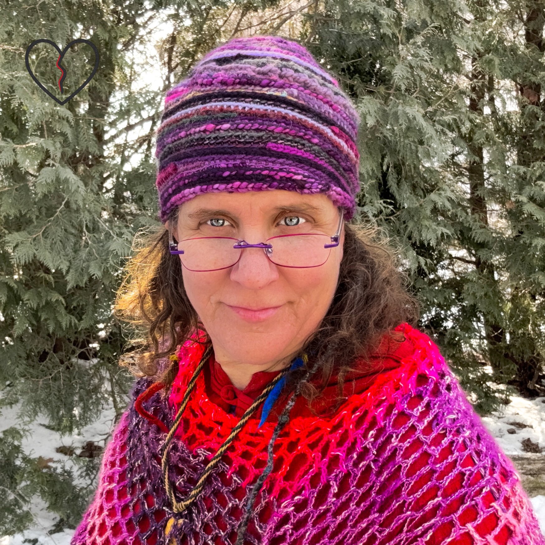 Close view of layered art yarn textures in Purple Tornado freeform crochet hat, one of a kind wearable fiber art.