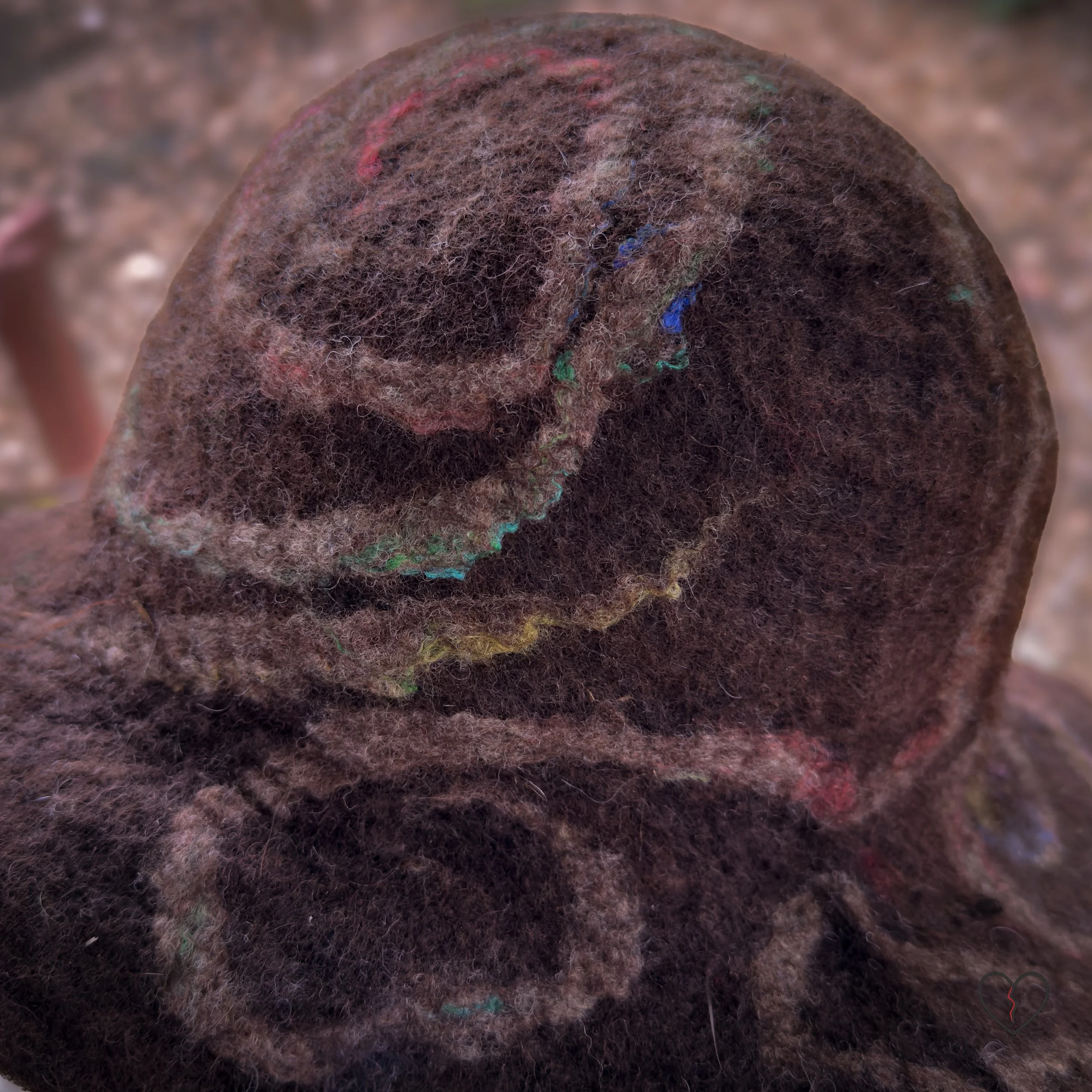 Close-up of brown wool texture with natural white wool and dyed silk swirls