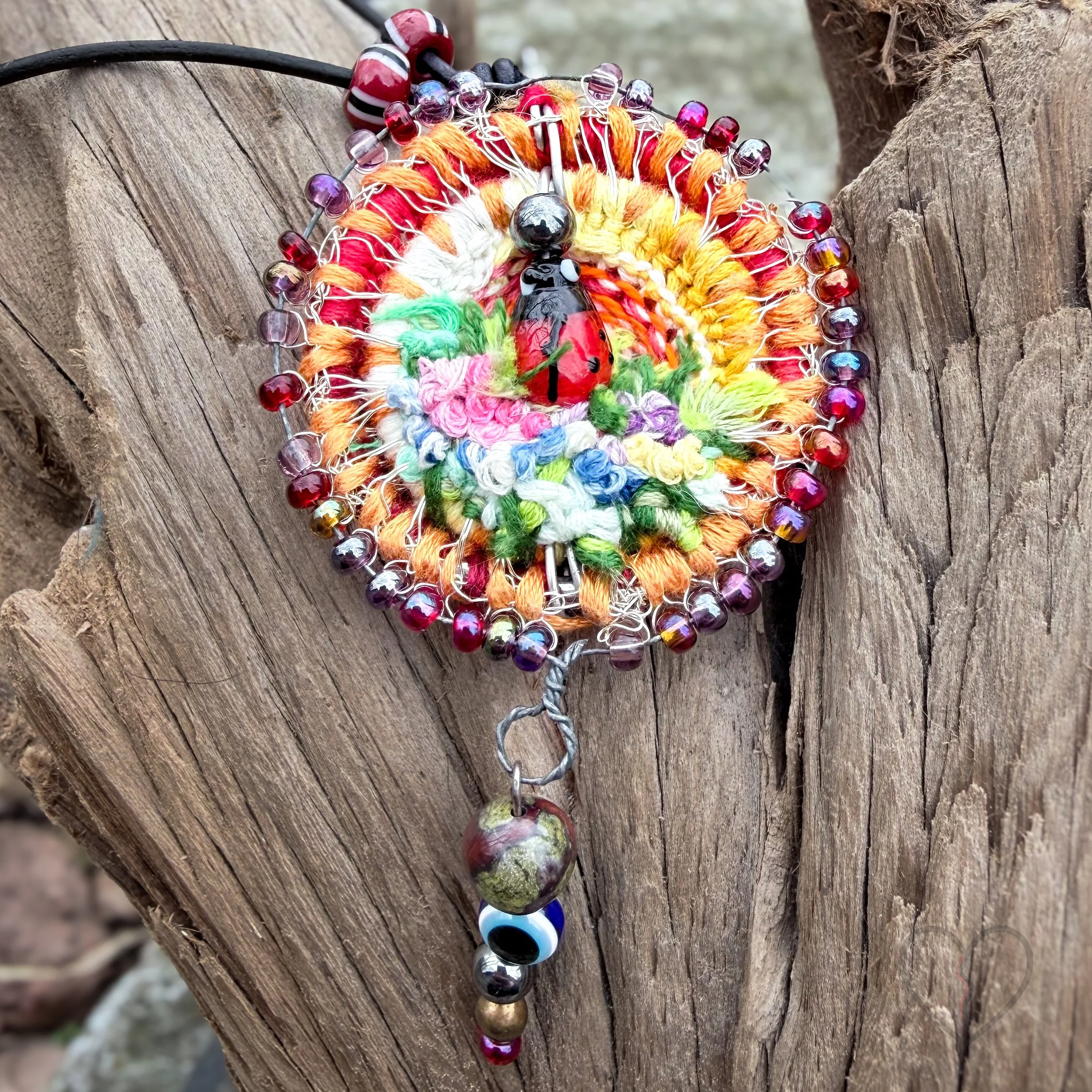 Handmade fiber necklace with jasper hematite and evil eye bead