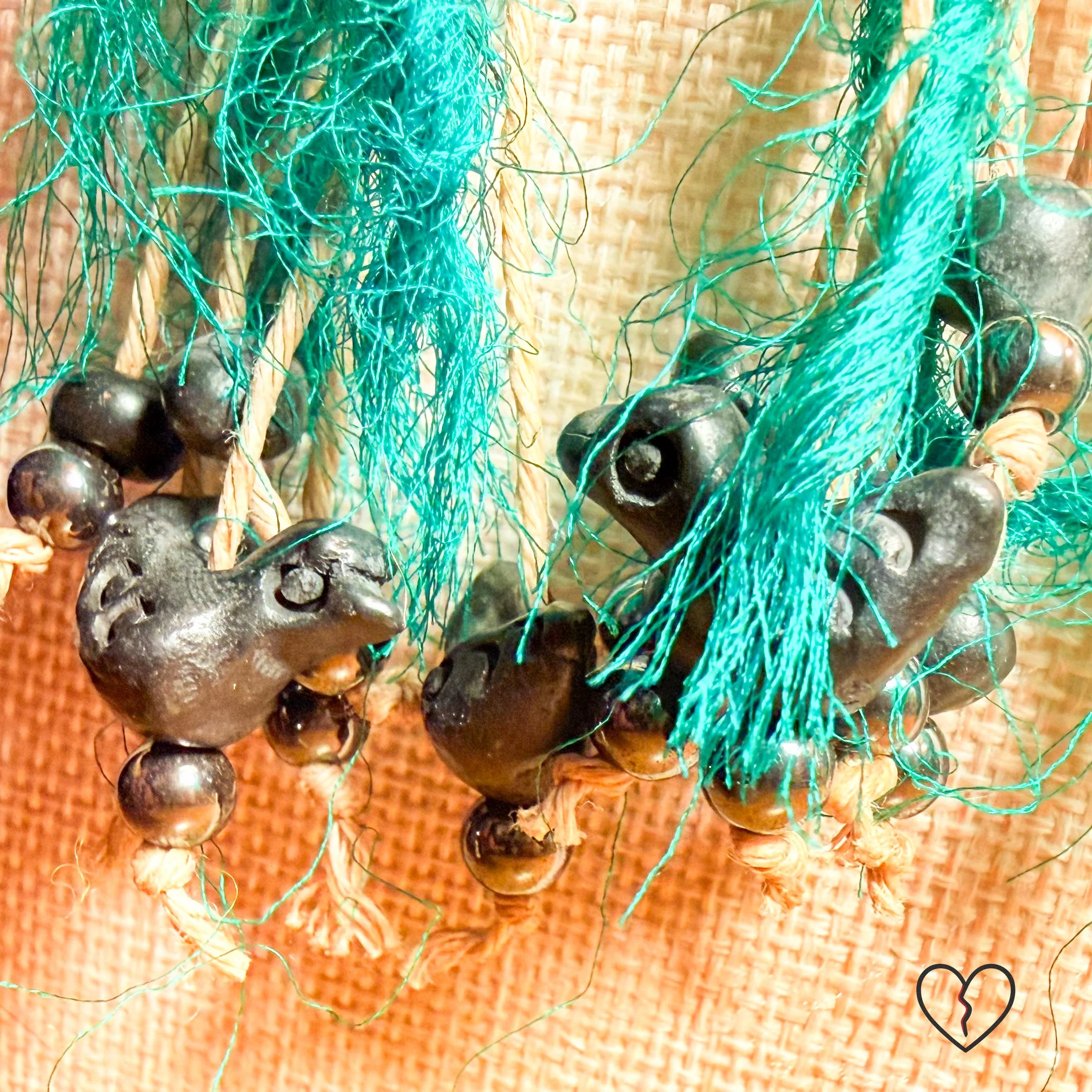 Horn bird beads with hematite grounding elements