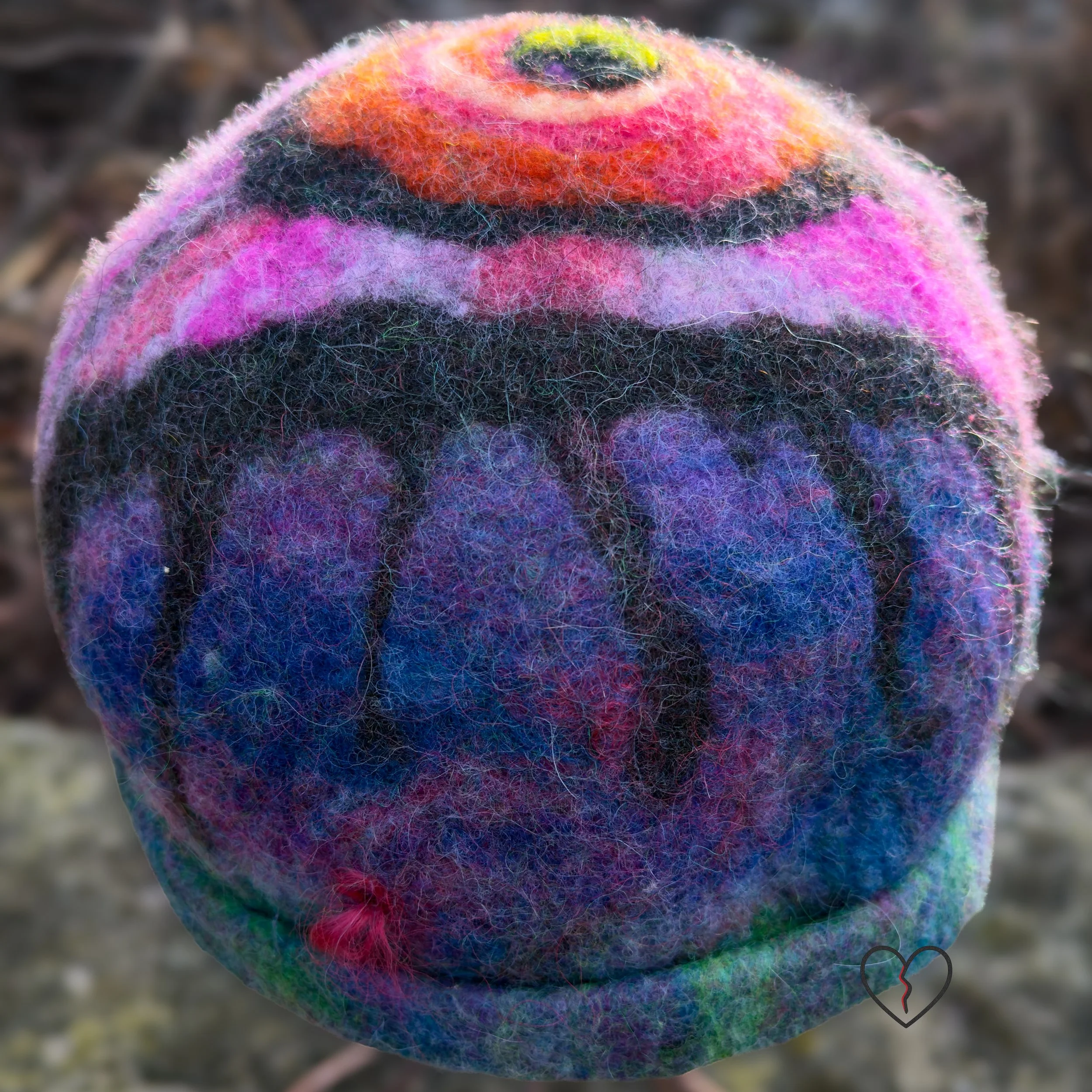 Hand-felted wool hat with a symbolic eye and celestial purple-blue design.