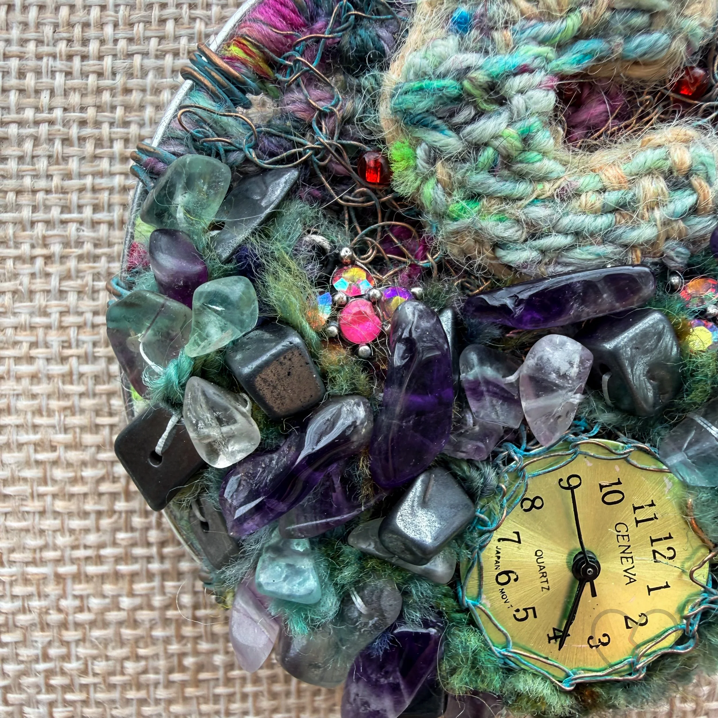 Mixed media fiber necklace with crystals and broken clock face on leather cord