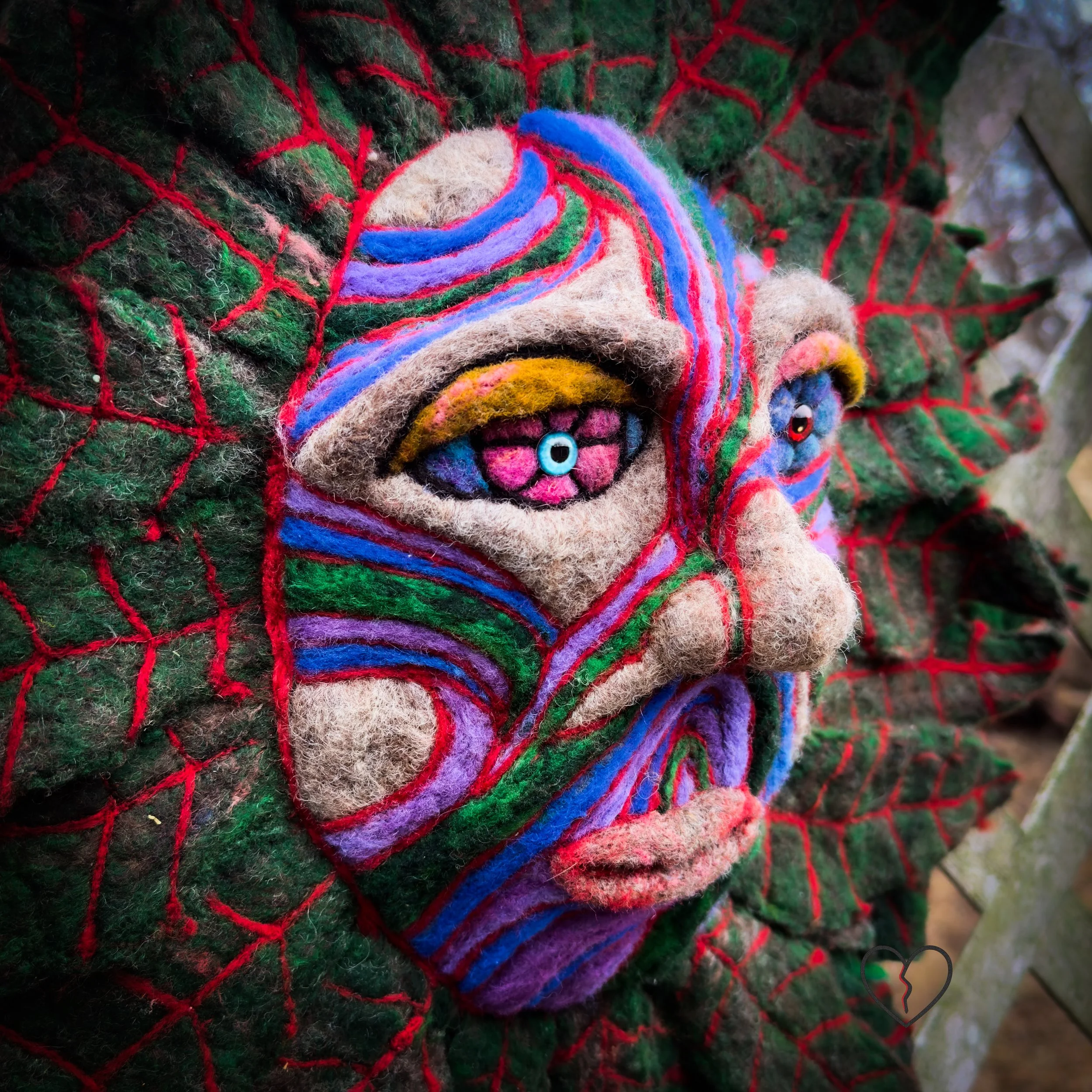 Textured fiber sculpture combining wet felting and needle felting