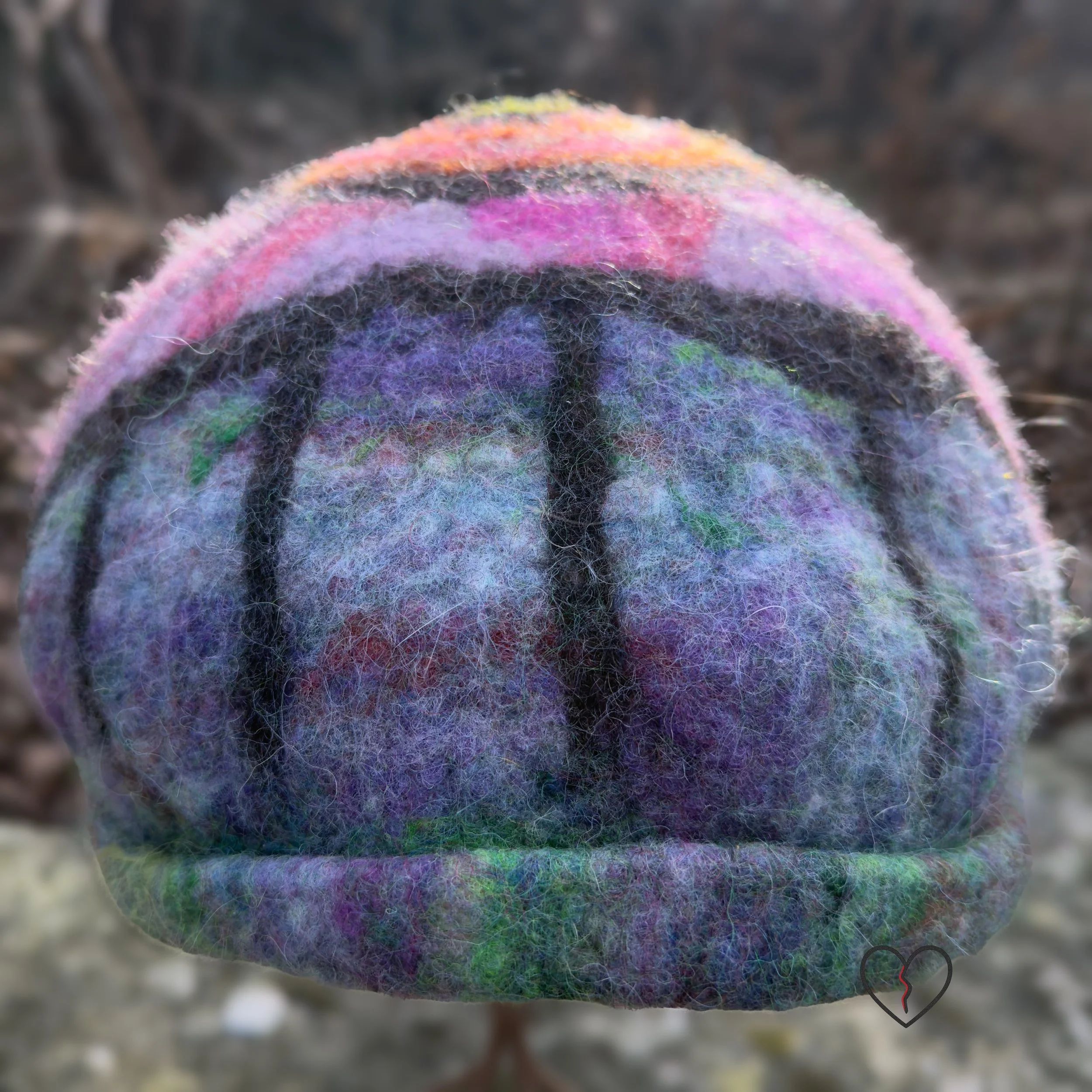 Hand-felted wool hat with a symbolic eye and celestial purple-blue design.