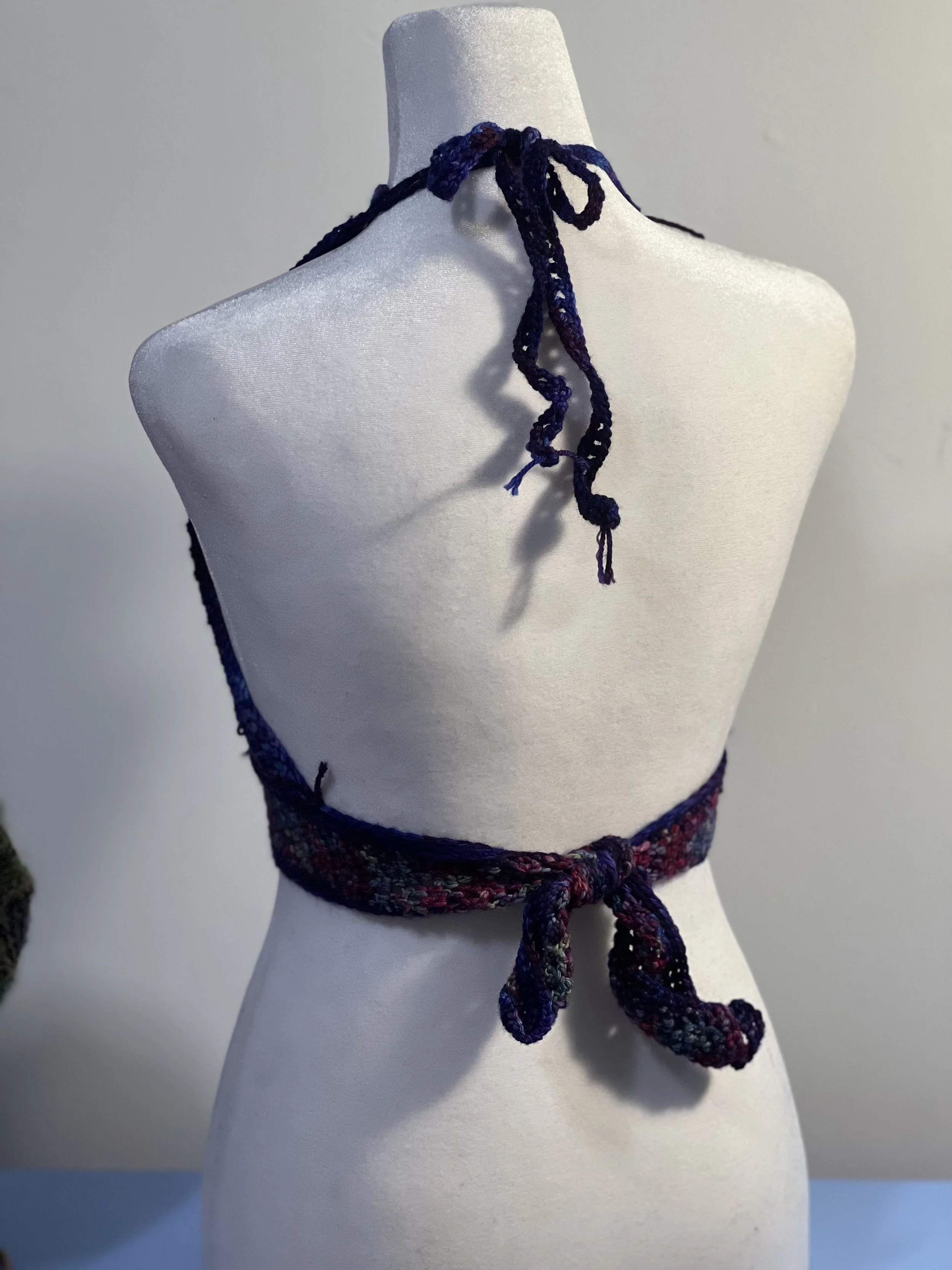 Long fringe detail on crochet halter top