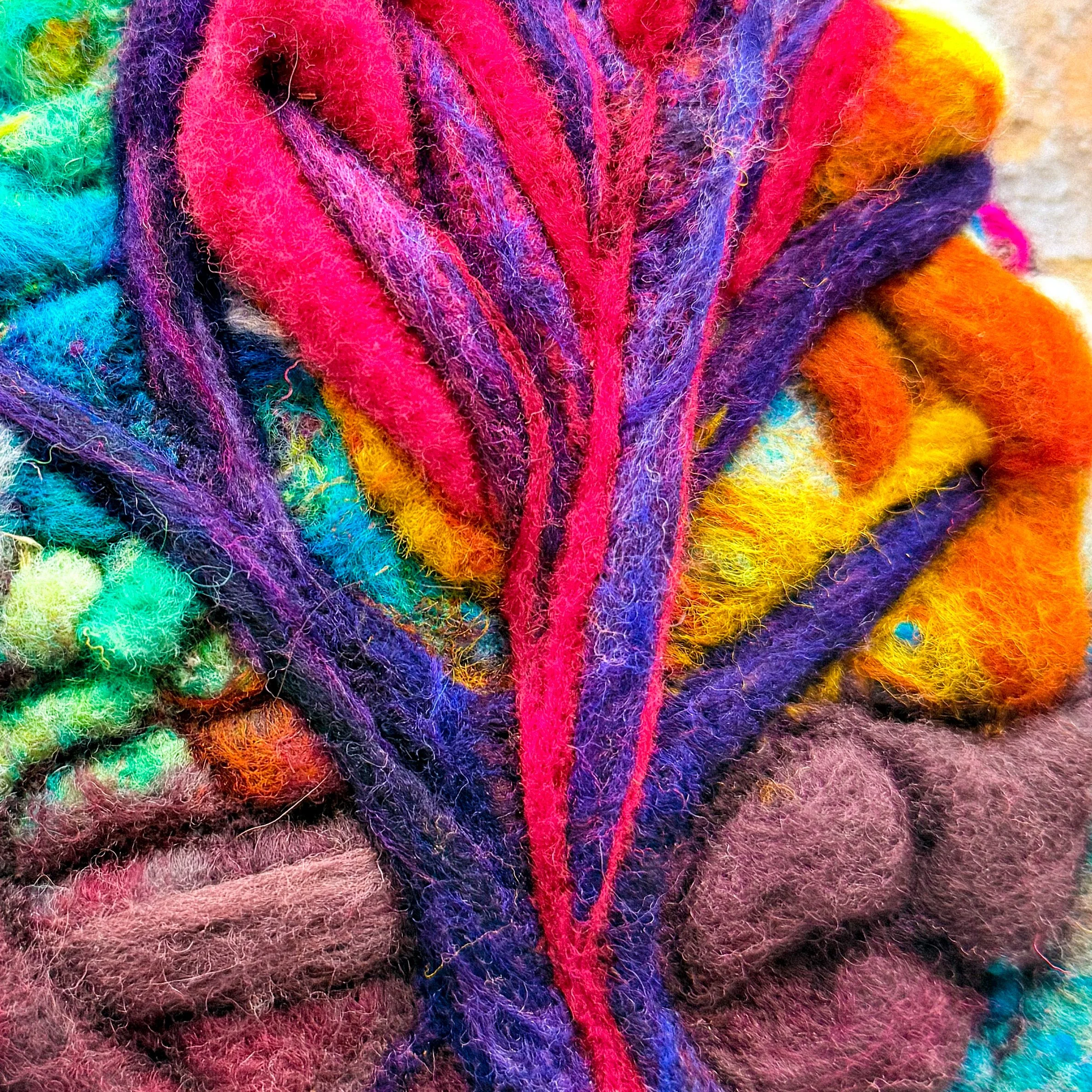 Pierced Compassion is a 7 x 8 inch needle felted wool artwork depicting a sunrise landscape pierced heart and tree of sorrow by fiber artist Kristi Yapp.