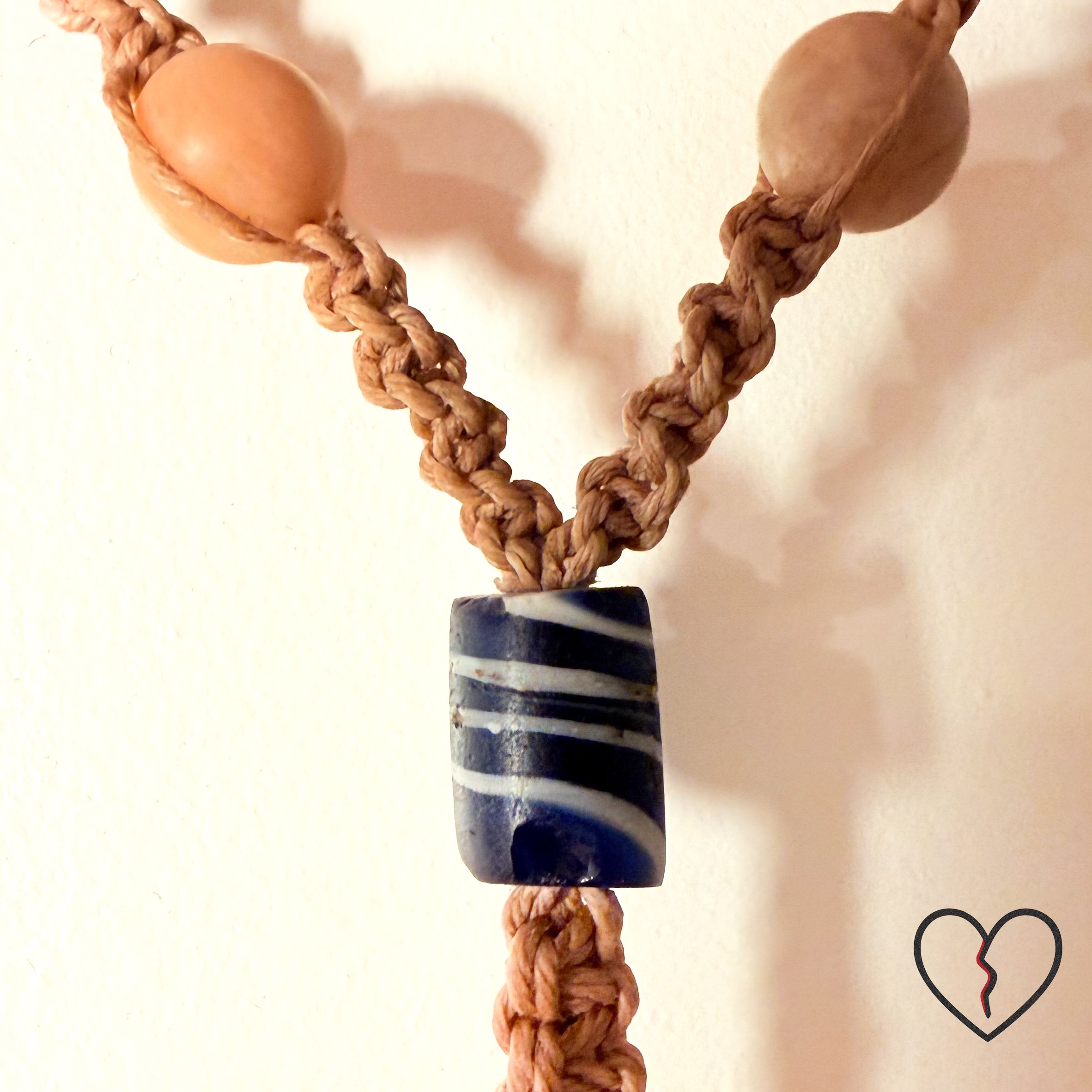 Freeform crochet fiber ring showing hand dyed wool and sari silk texture.