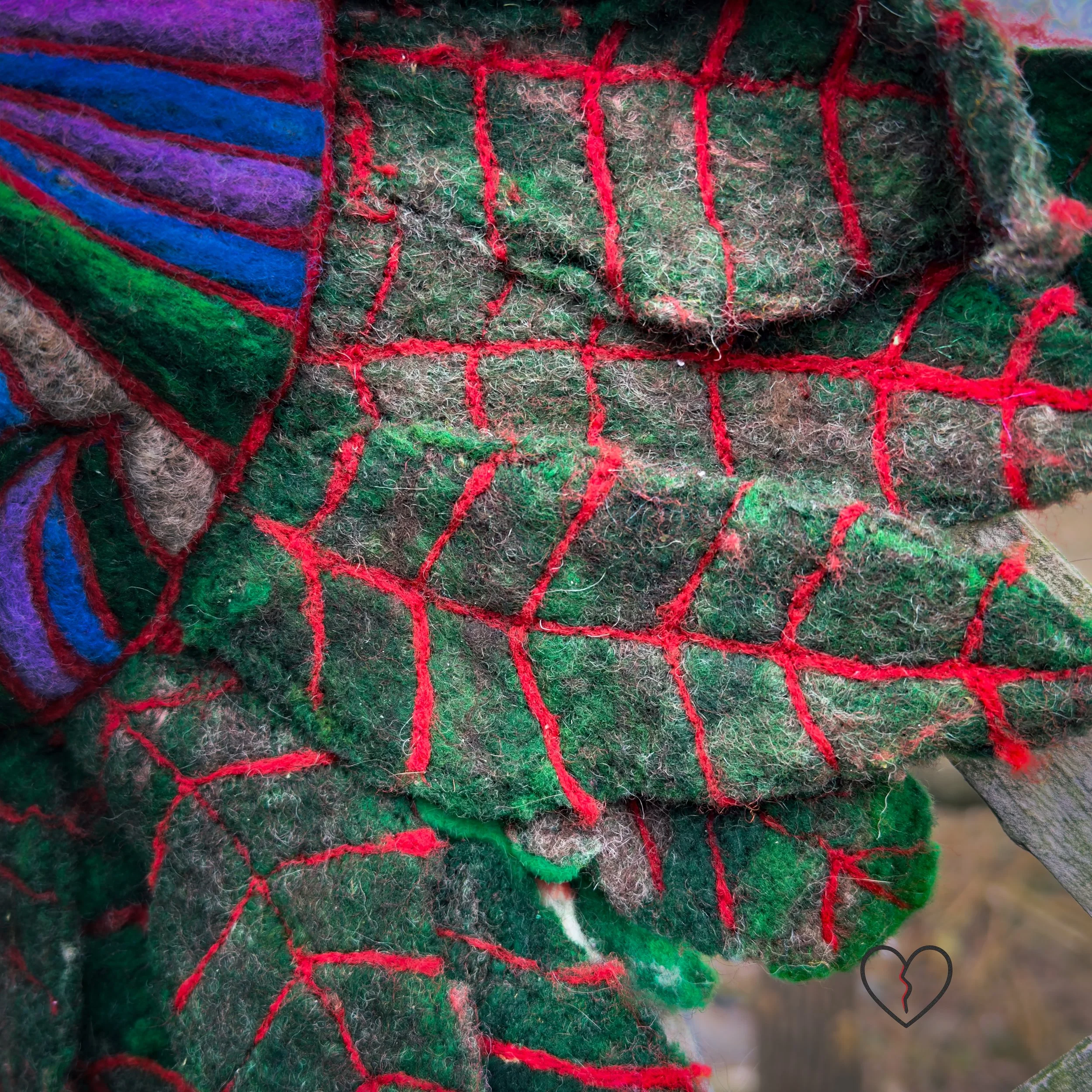 Textured fiber sculpture combining wet felting and needle felting
