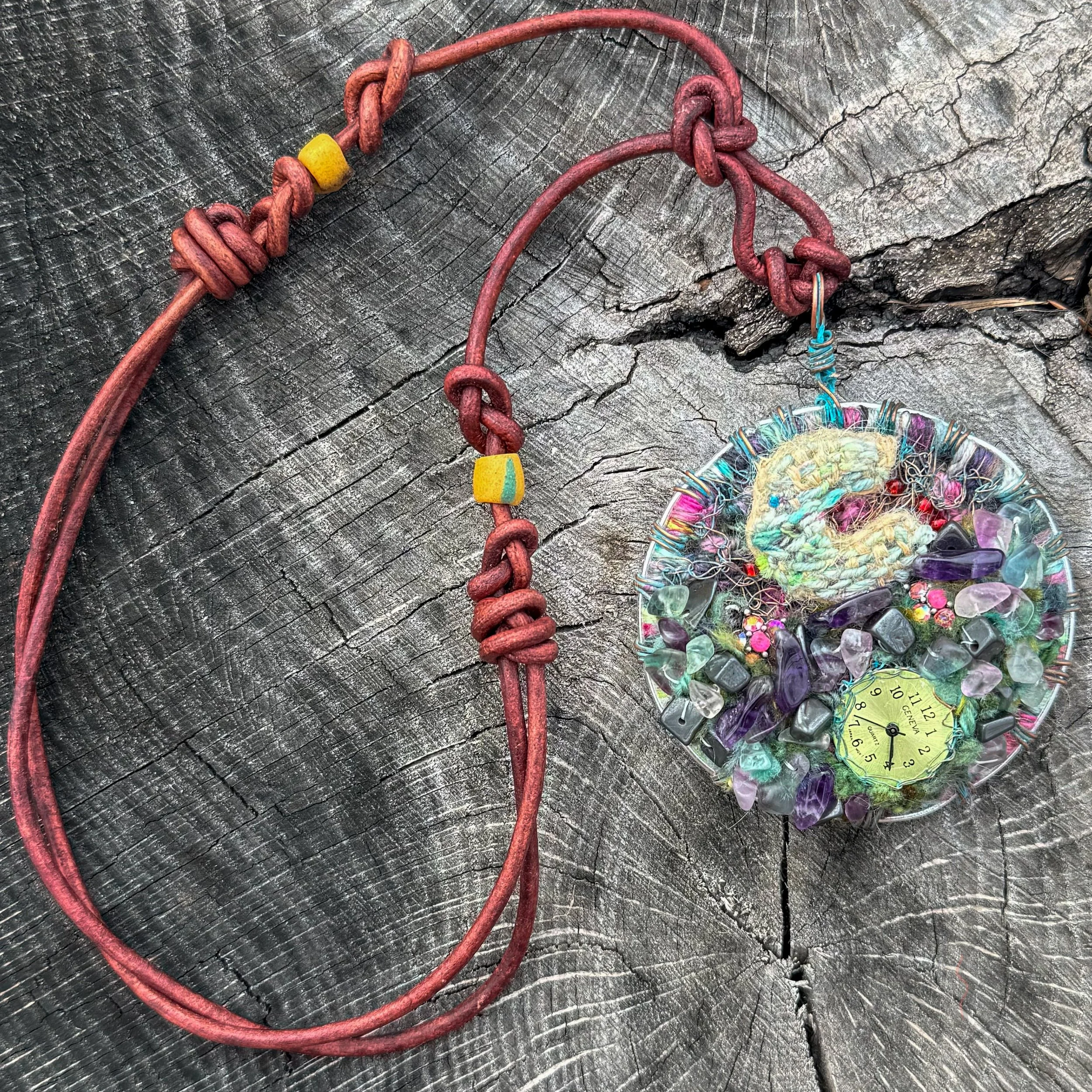Mixed media fiber necklace with crystals and broken clock face on leather cord