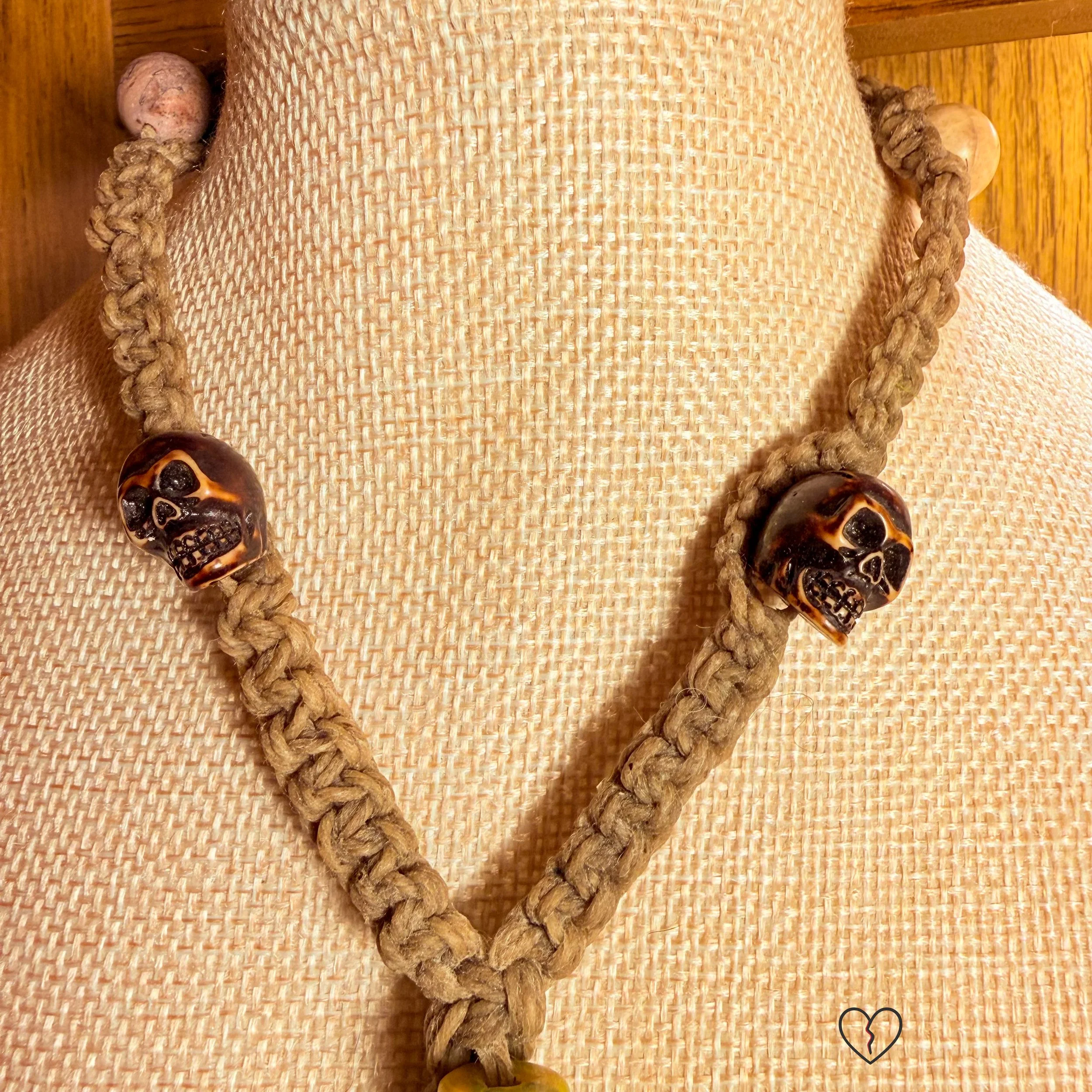 Glass evil eye beads guarding sides of circular pendant