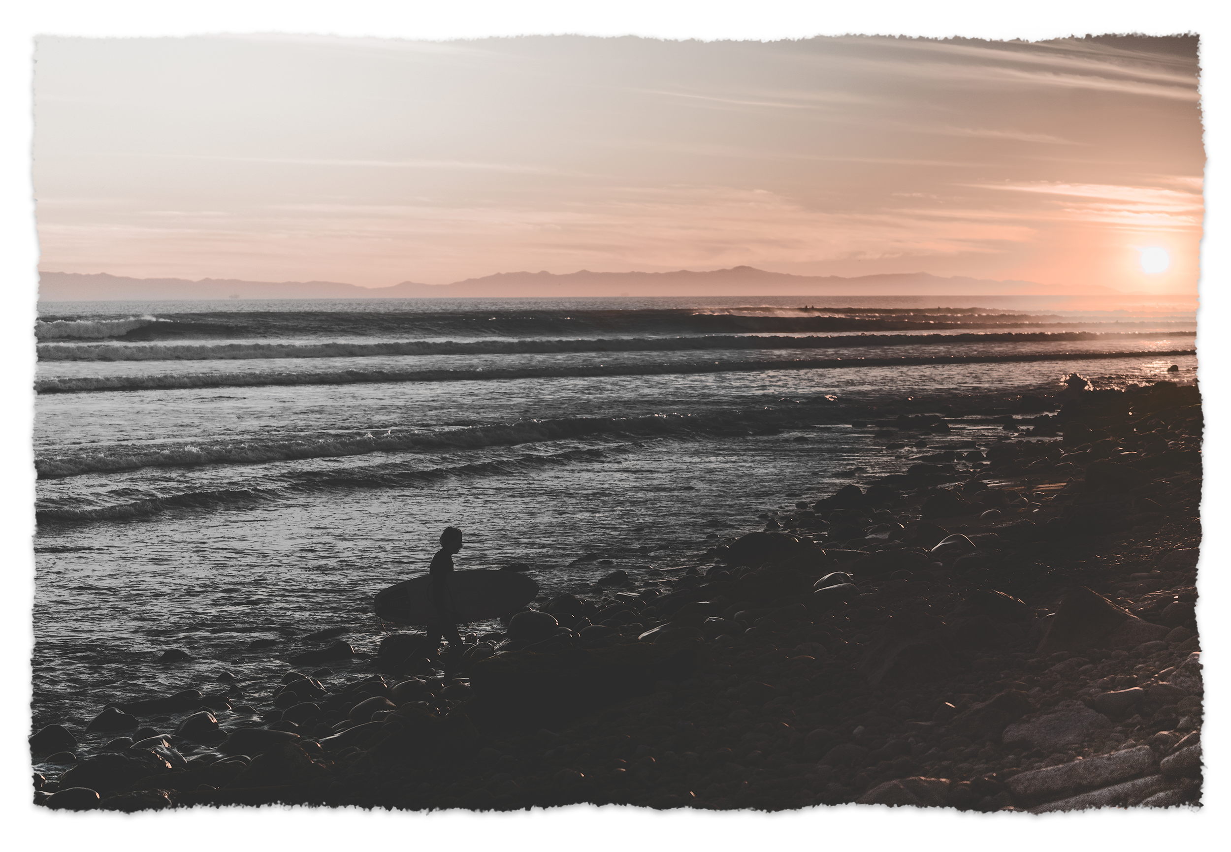 rag-lowtide-surfer-sunset-california-coast.png