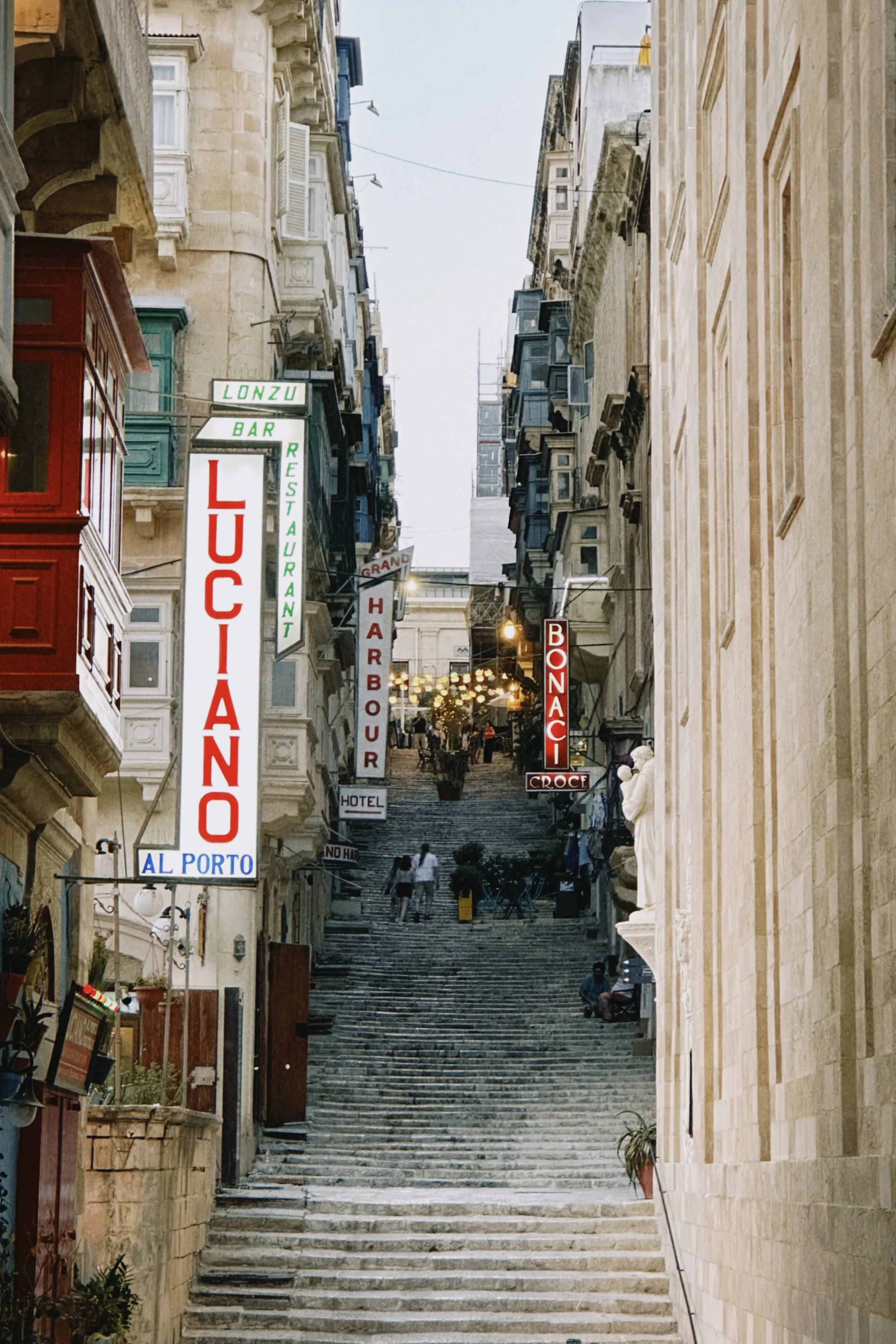 Narrow streets of Valletta with its stone steps leading up to St John's street.