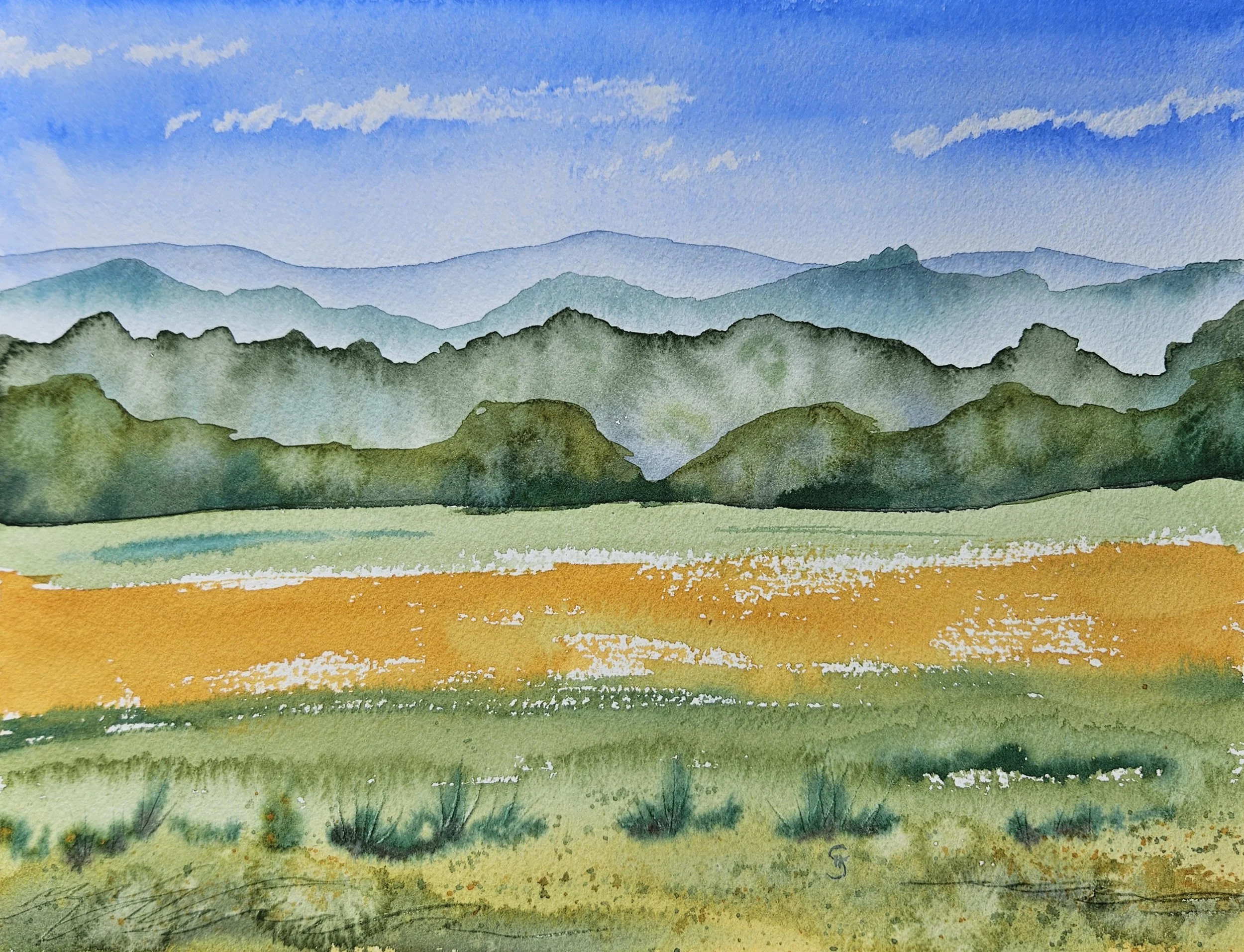 Layers of watercolor paint creating trees fading into the distance with a gold field and grass in front.