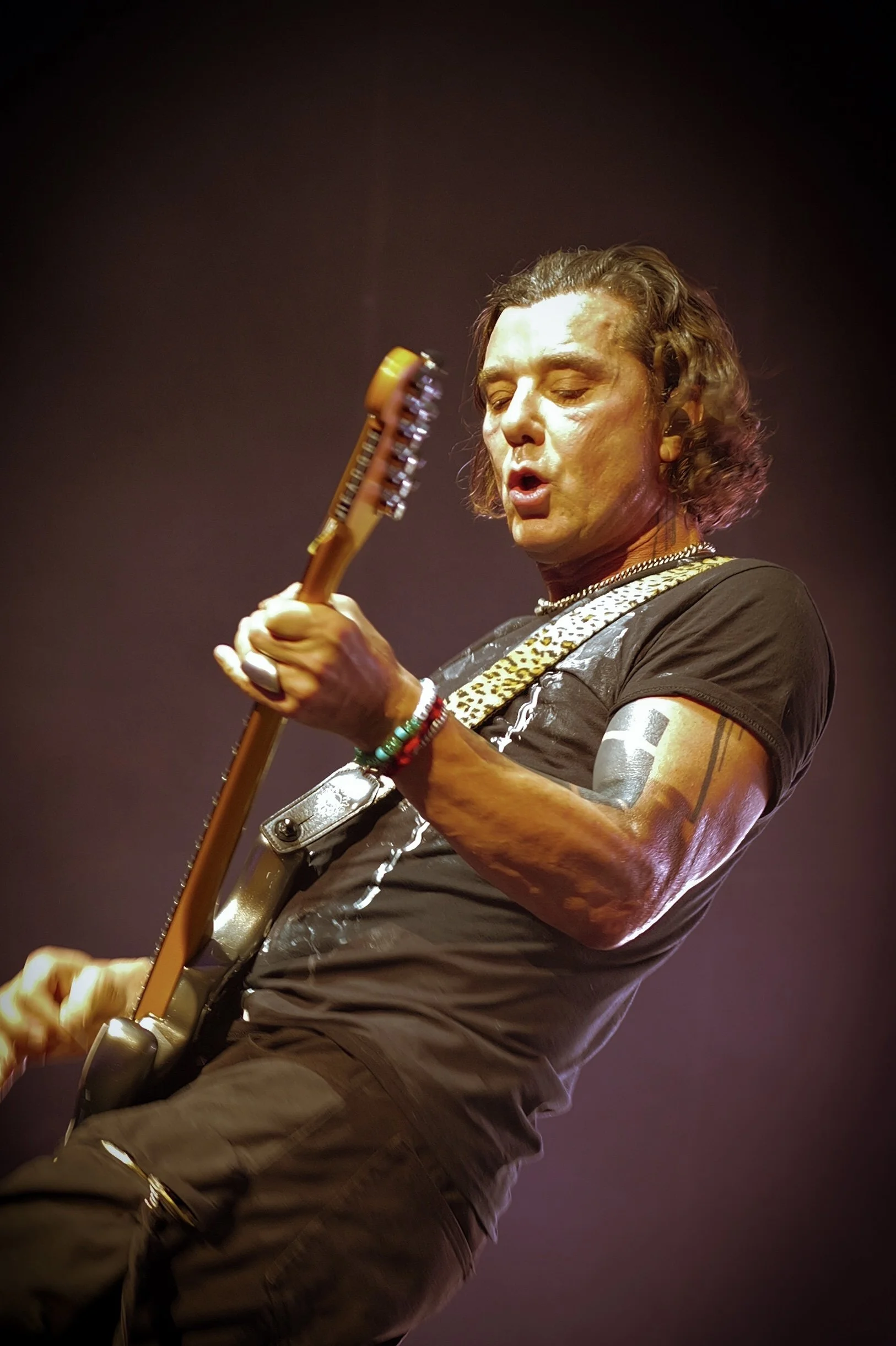 Gavin Rossdale of the rock band BUSH playing an electric guitar on stage at Mohegan Sun Arena in Uncasville Connecticut.