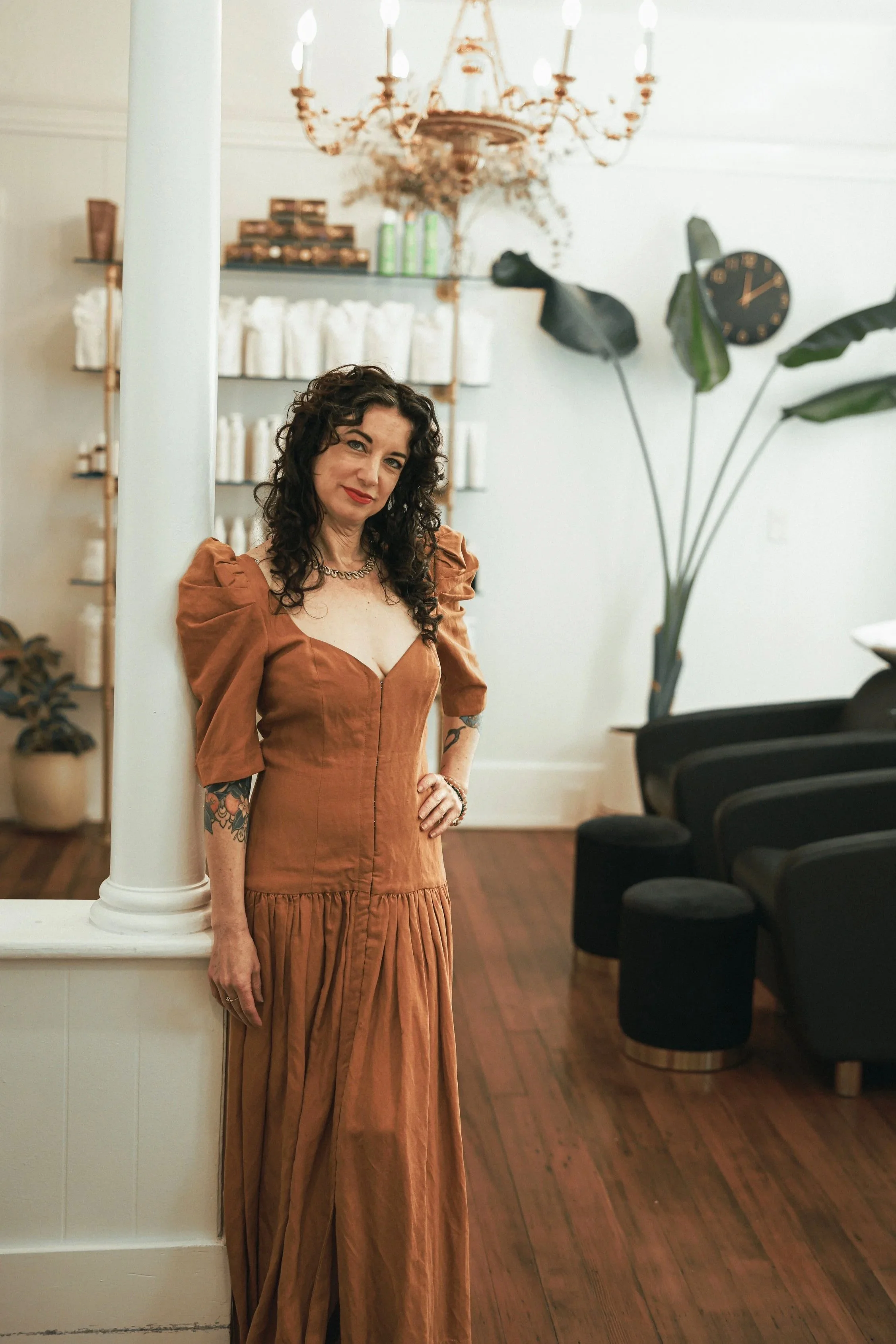 Andrea Neal-Thiesen, founder and curl specialist at Gilded Fox, smiling in the salon, Portland Oregon curly hair salon