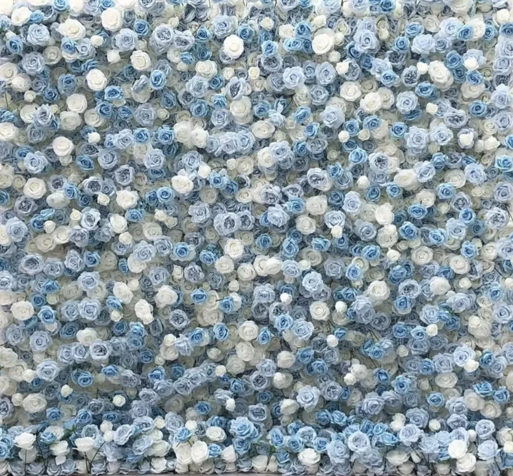 A wall covered with numerous small blue and white roses.