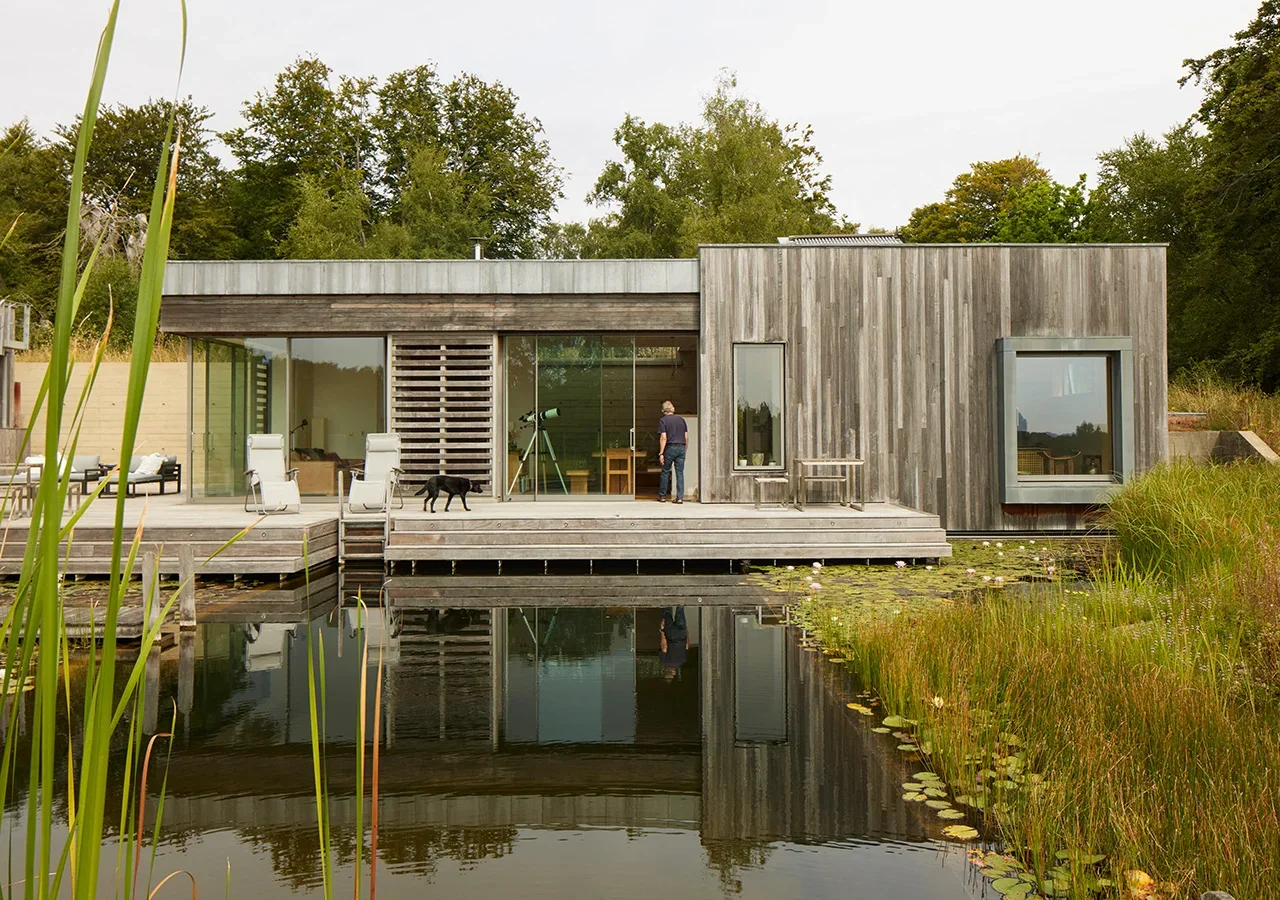 NEWFORESTHOUSE_PAD_studio_landscape_solarcontrol_weatheredtimbercladding_naturalpool.webp