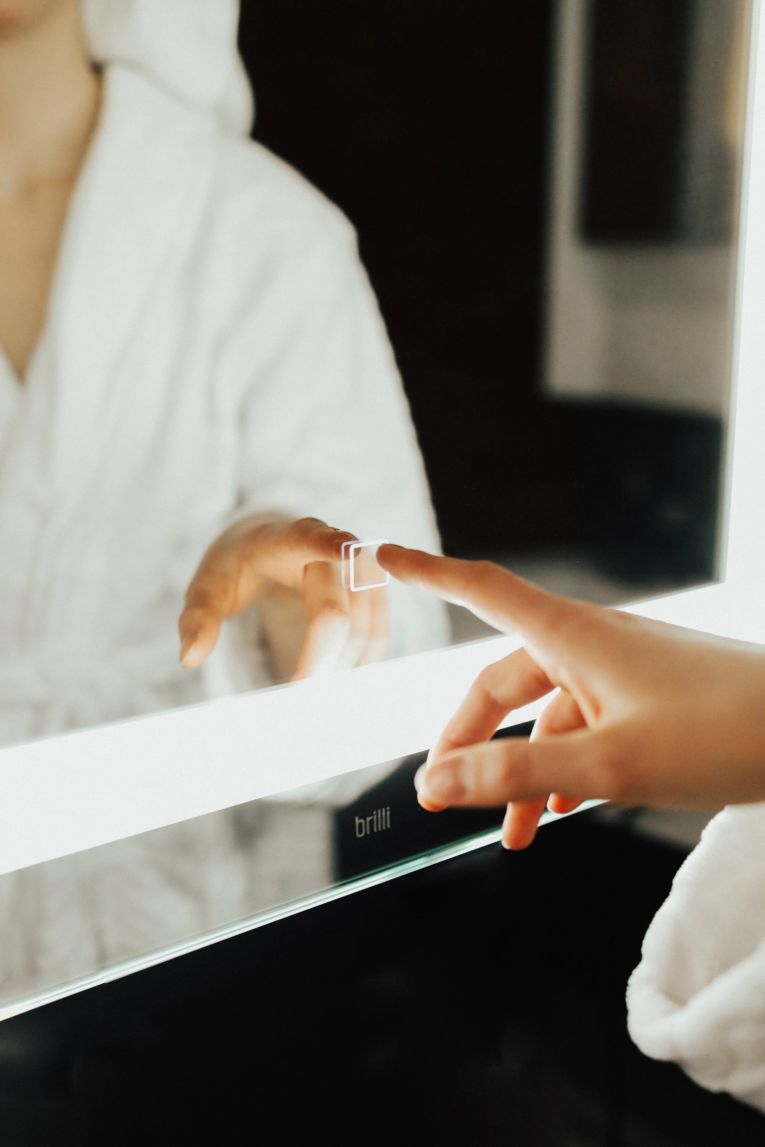 Person pressing a button on a microwave oven.
