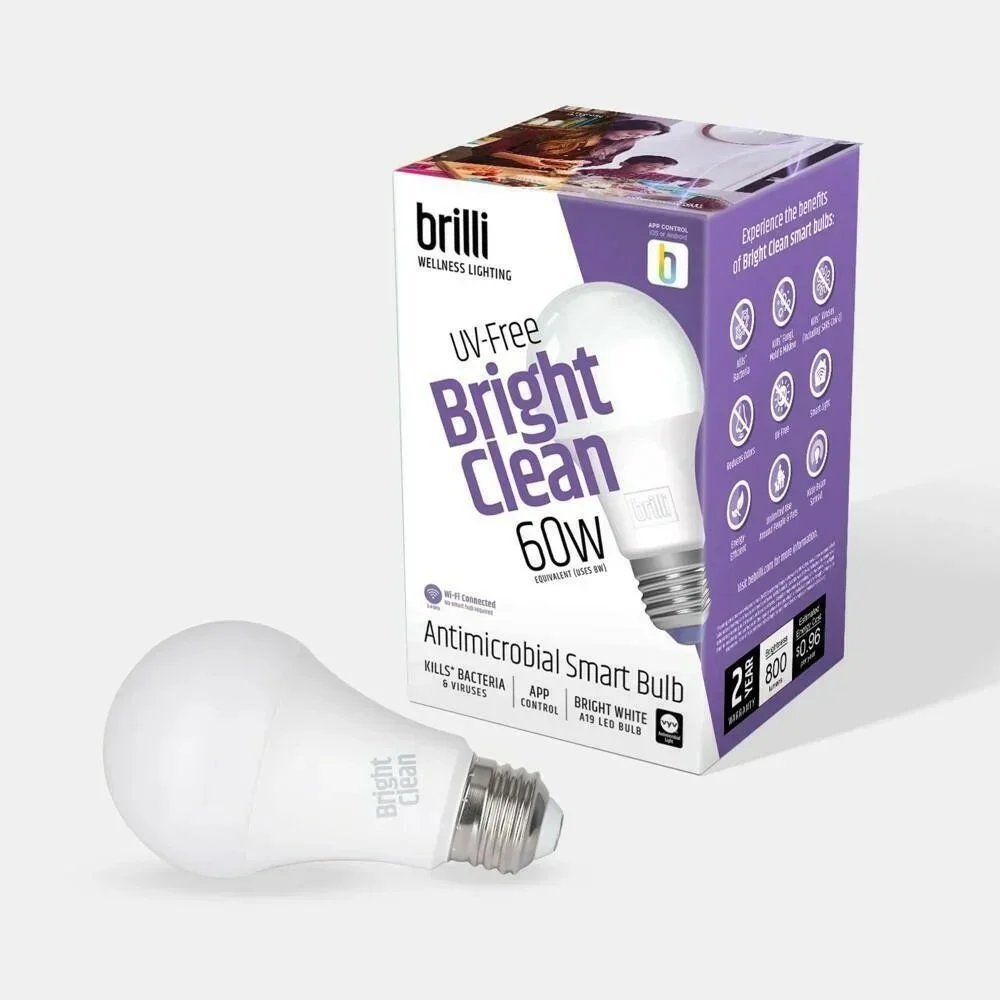 A white antimicrobial smart bulb and its packaging box. The box is purple and white with text indicating it is a UV-Free Bright Clean 60W equivalent LED bulb with app control and bright white light. The bulb is labeled Bright Clean.