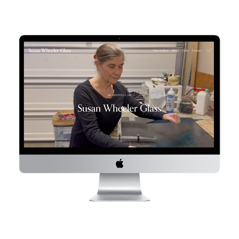 Screenshot of Susan Wheeler Glass website showing a woman working with glass in a workshop.