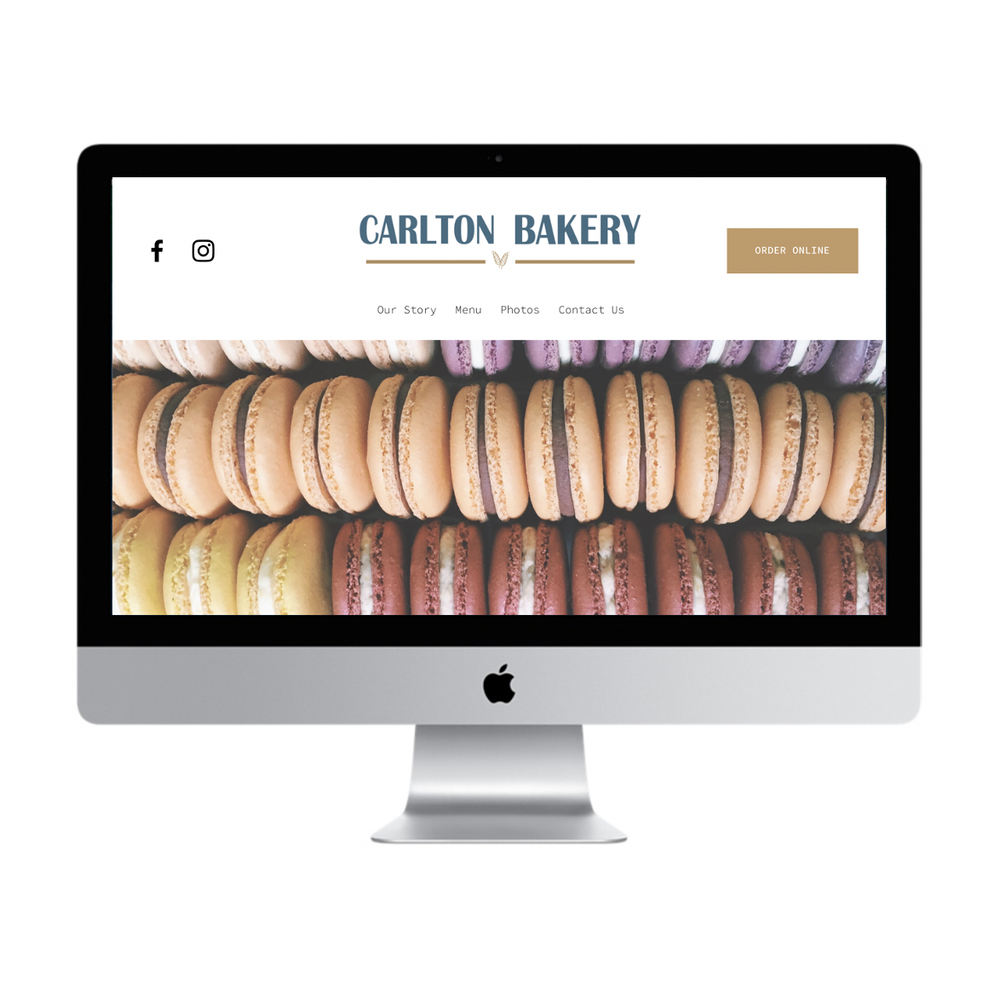 Computer screen displaying a bakery website with a photo of colorful macarons.