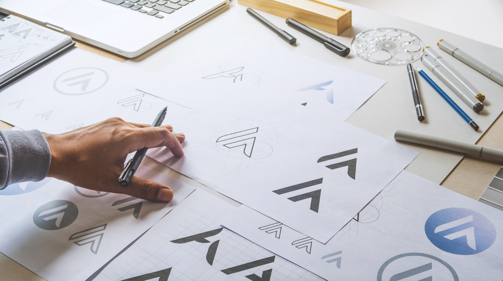 	
Custom Logo Design for small business in Arizona, close up of sketches on paper.