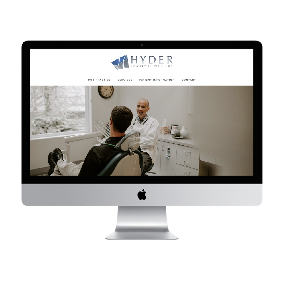 A computer screen displaying the homepage of HYDER Family Dentistry with an image of a dentist talking to a patient in a dental office.