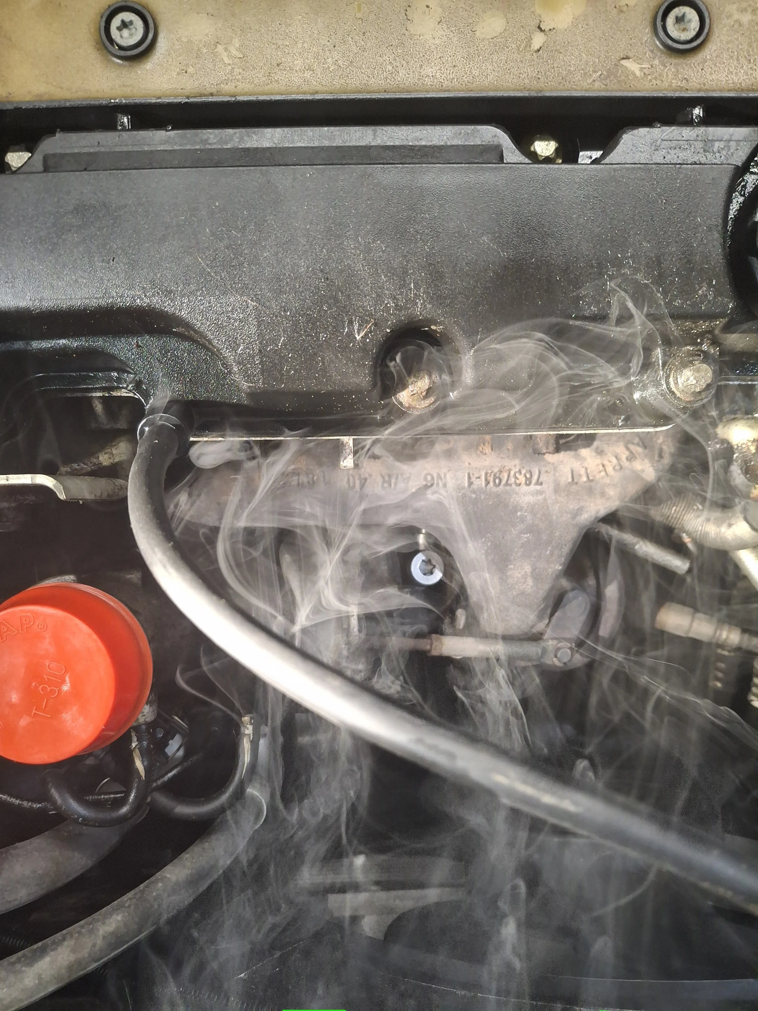 A bad valve cover gasket found with our smoke machine.