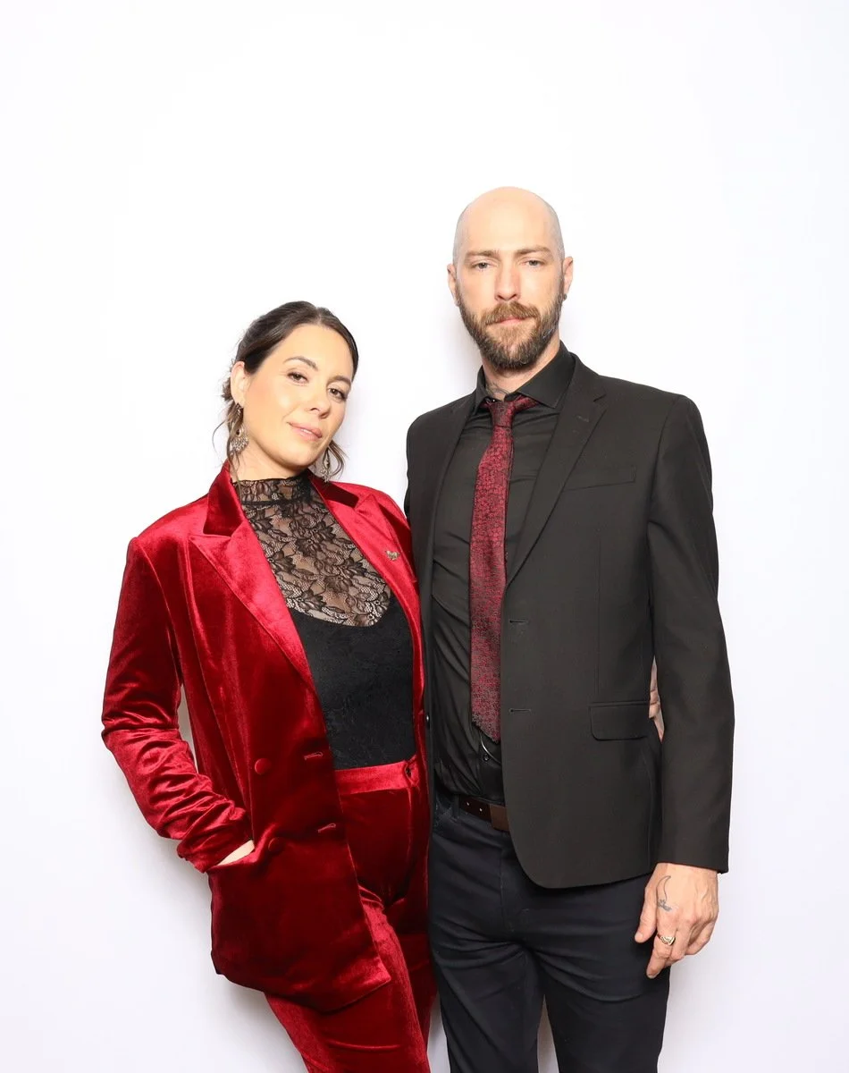 Branded photo activation at a DFW gala — guests smiling with custom print keepsakes
