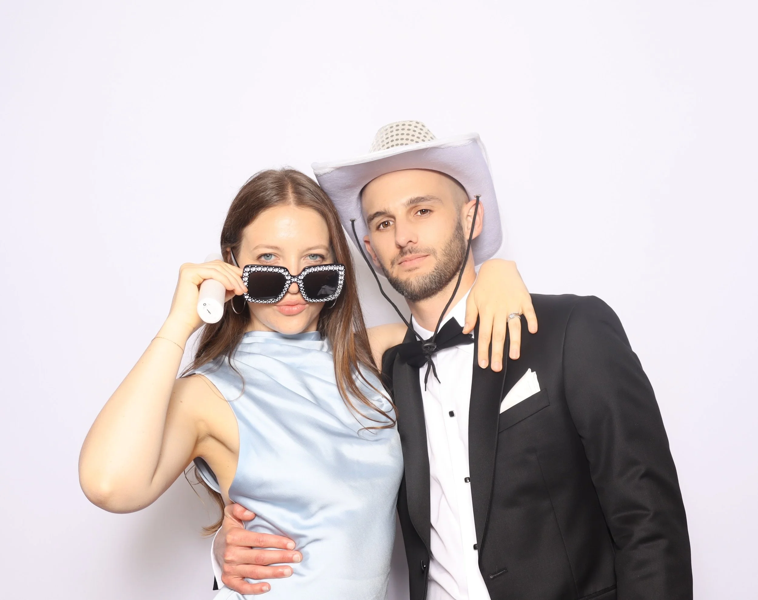 Branded photo activation at a DFW gala — guests smiling with custom print keepsakes