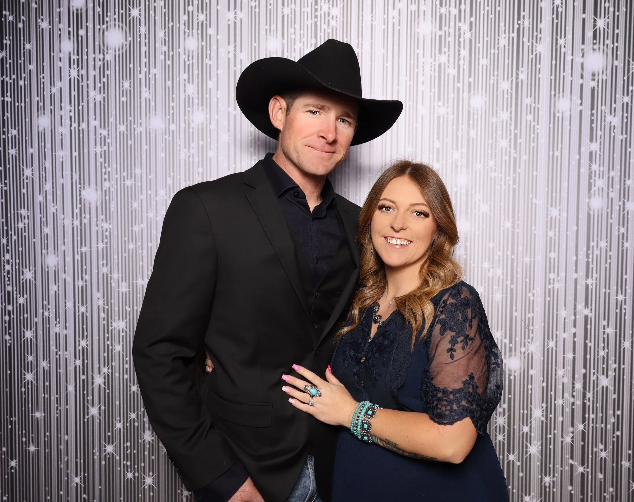 Premium photo booth activation at a Dallas gala event with custom backdrop and branded prints