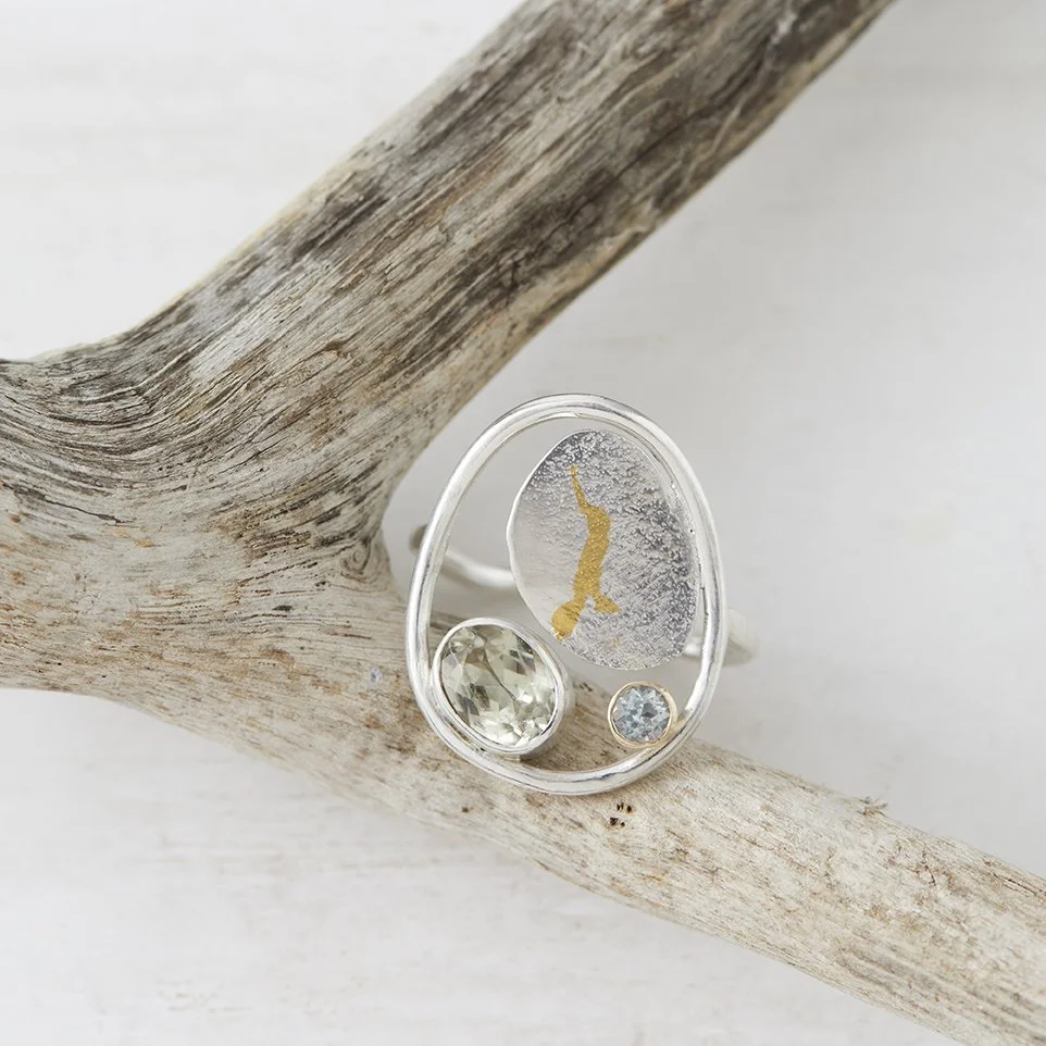 Bay Ring - Featuring dendritic quartz, sky blue topaz, recycled sterling silver, 9ct settings and 24ct gold keum-boo, the Bay Ring draws inspiration from the Island's shoreline and tidal landscape. Handcrafted using traditional goldsmithing technique