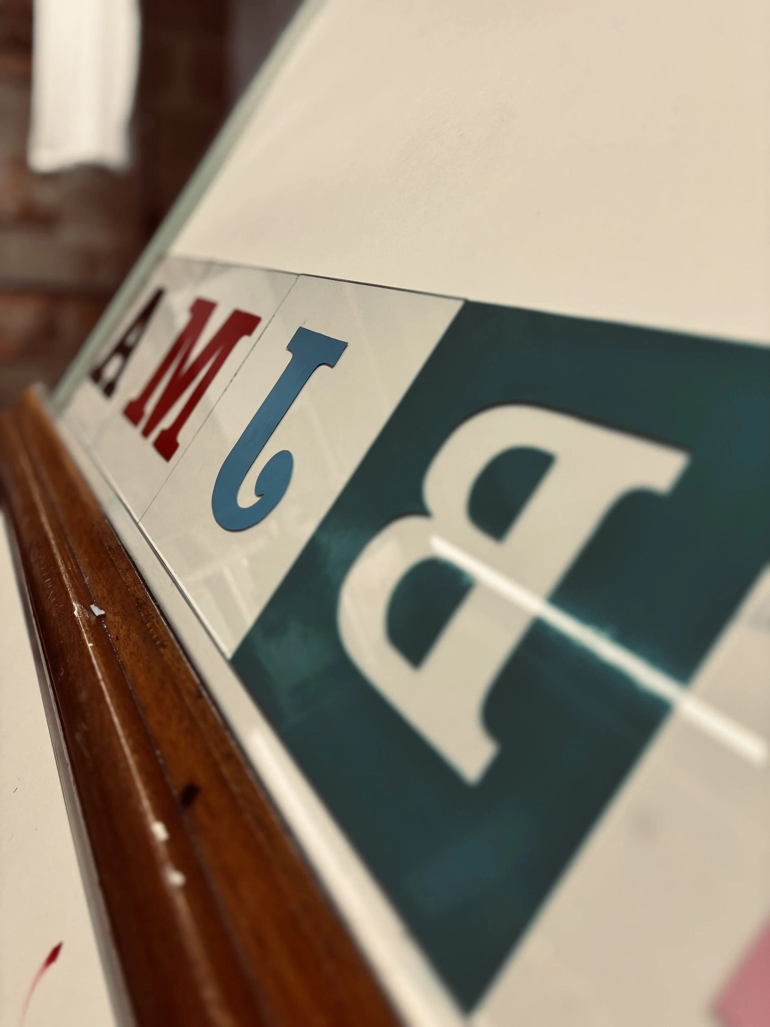letters hand painted on glass.jpg